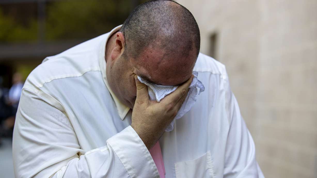 Paul Jamrowski, father of two people who both died in the El Paso Walmart mass shooting, breaks down in tears while speaking to the media outside the federal court in El Paso, Texas, Wednesday.