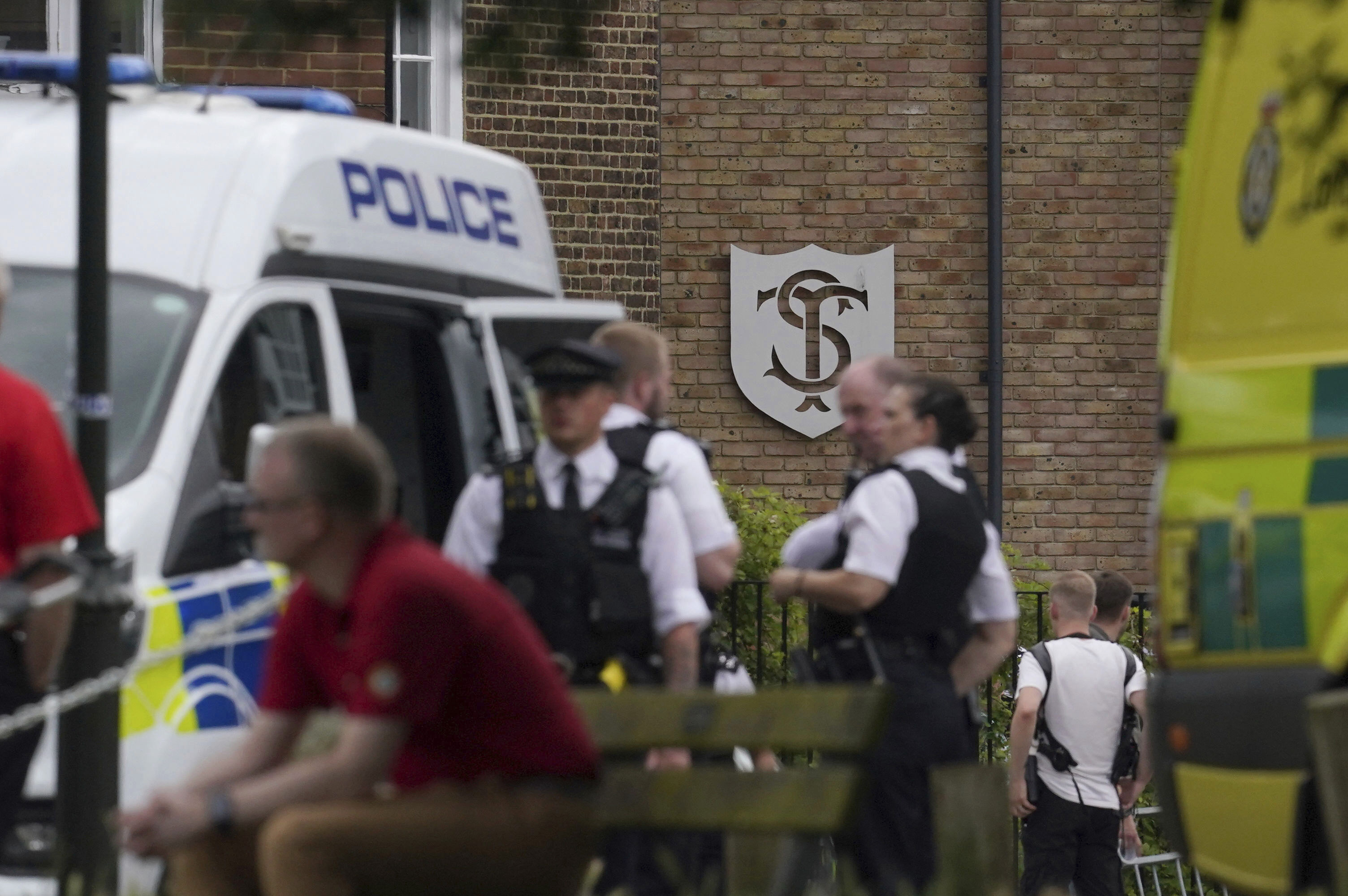 A view of the scene of an incident at a primary school, in Wimbledon, London, Thursday, July 6, 2023. London police say seven children and two adults were injured after a car crashed into an elementary school in Wimbledon in southwest London. 