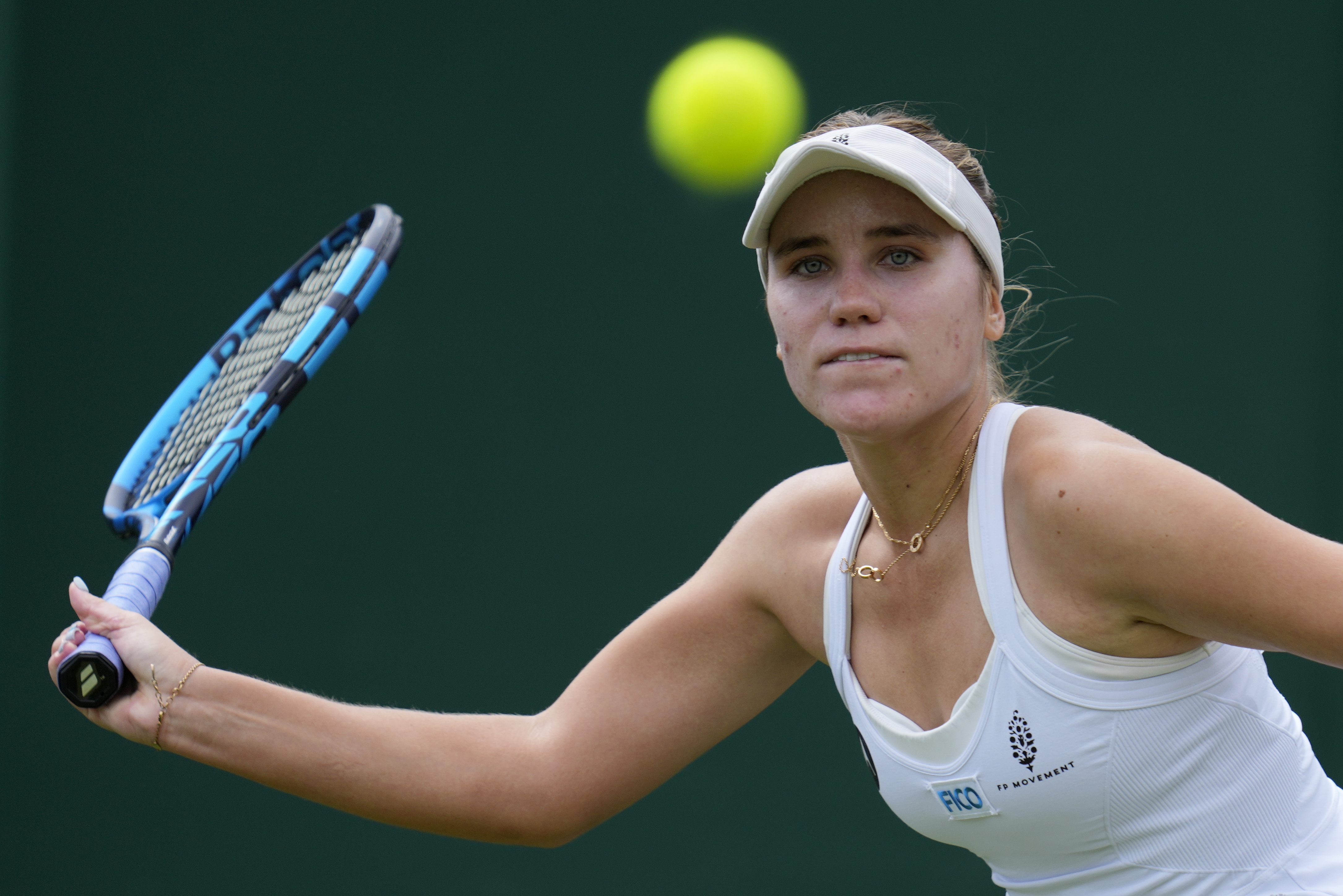 Sofia Kenin of the US returns to China's Wang Xinyu in a women's singles match on day four of the Wimbledon tennis championships in London, Thursday, July 6, 2023.