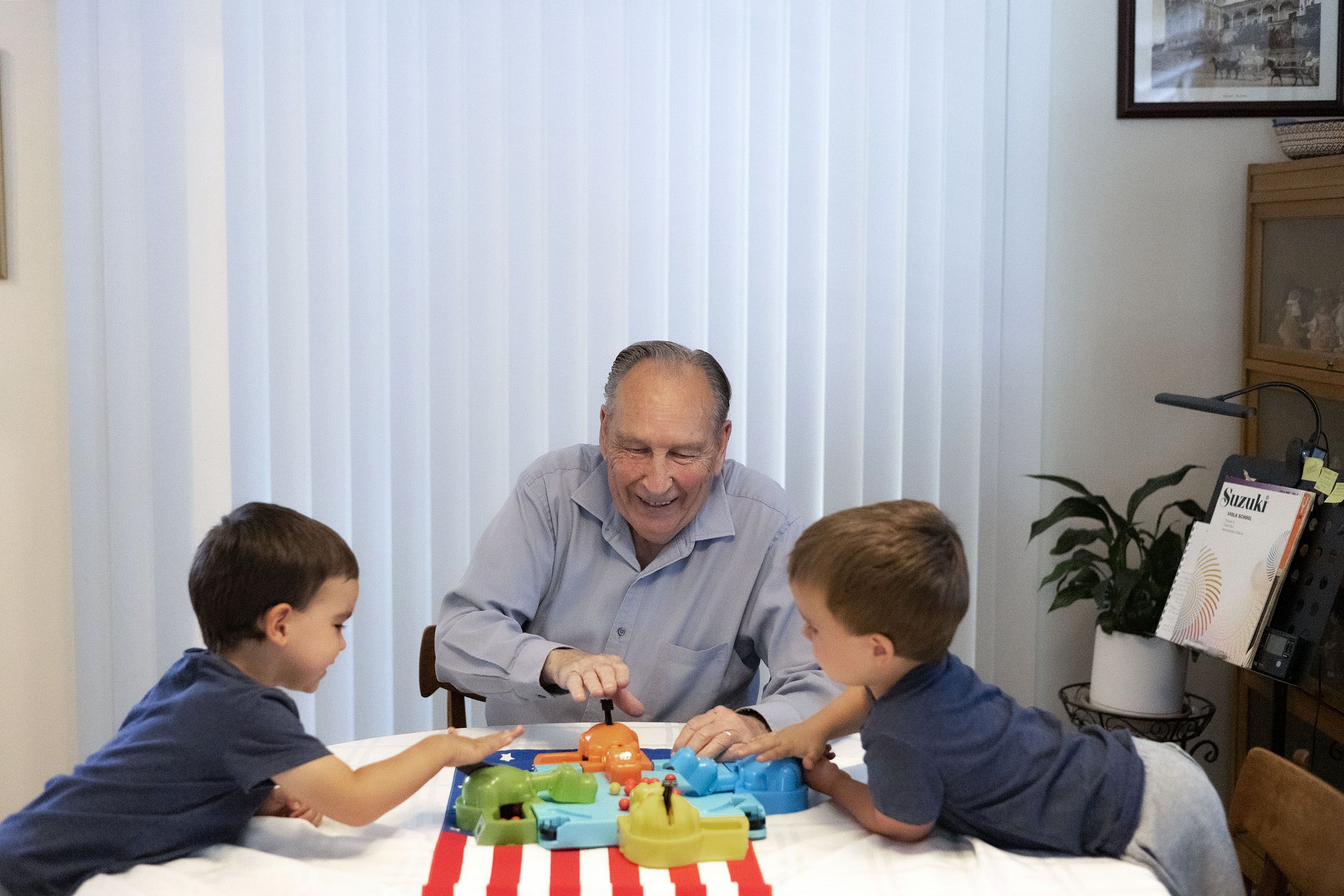 Ren Willie plays with his grandsons, Oliver and Tate, at his Murray home on Wednesday. A year ago, Willie was diagnosed with Alzheimer’s dementia, a progressive neurodegenerative disease that destroys memory and other mental functions over time.