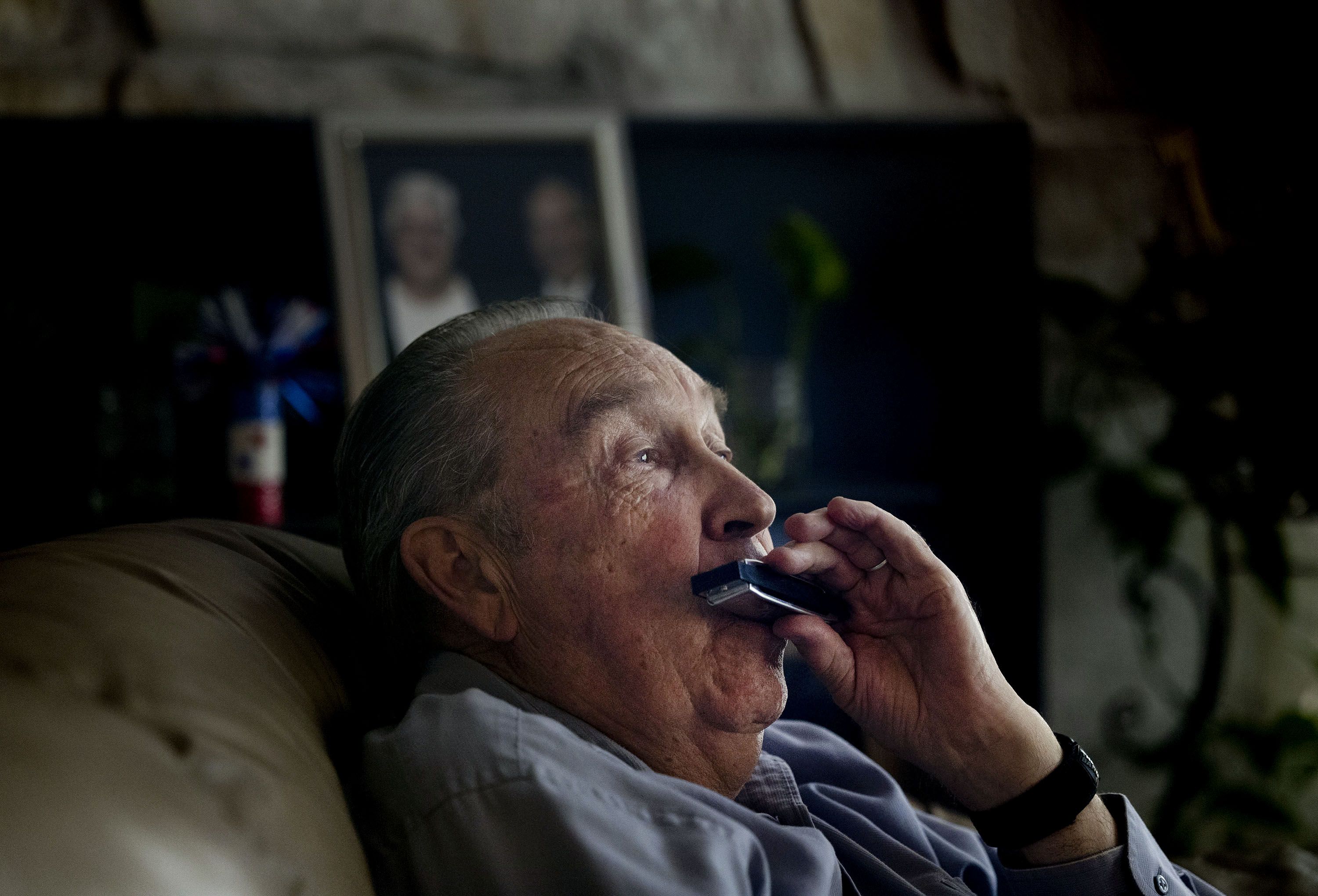 Ren Willie plays harmonica at his Murray home on Wednesday. A year ago, Willie was diagnosed with Alzheimer’s dementia, a progressive neurodegenerative disease that destroys memory and other mental functions over time.