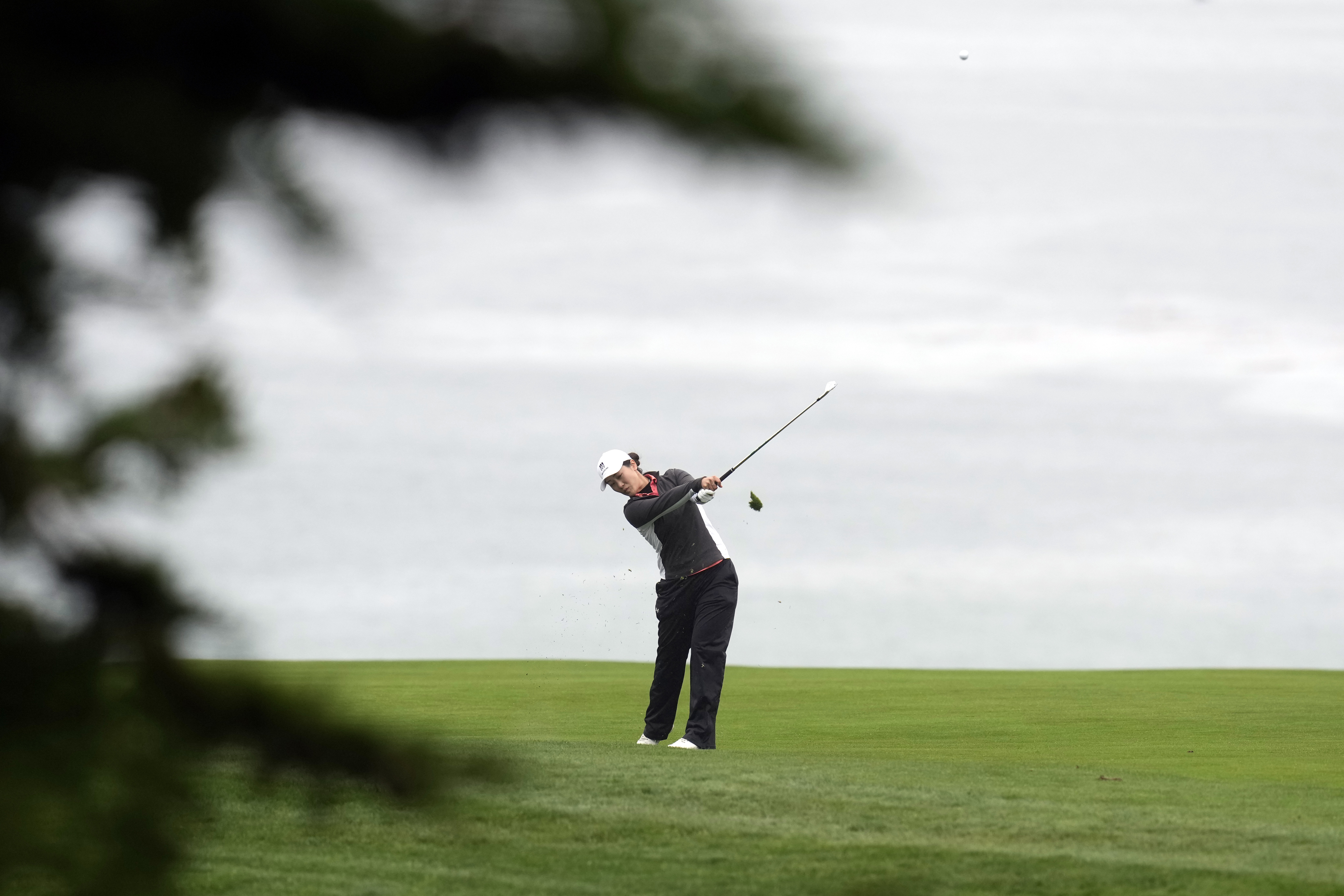 Xiyu Janet Lin, of China, hits from the fairway on the 11th hole during the first round of the U.S. Women's Open golf tournament at the Pebble Beach Golf Links, Thursday, July 6, 2023, in Pebble Beach, Calif. 