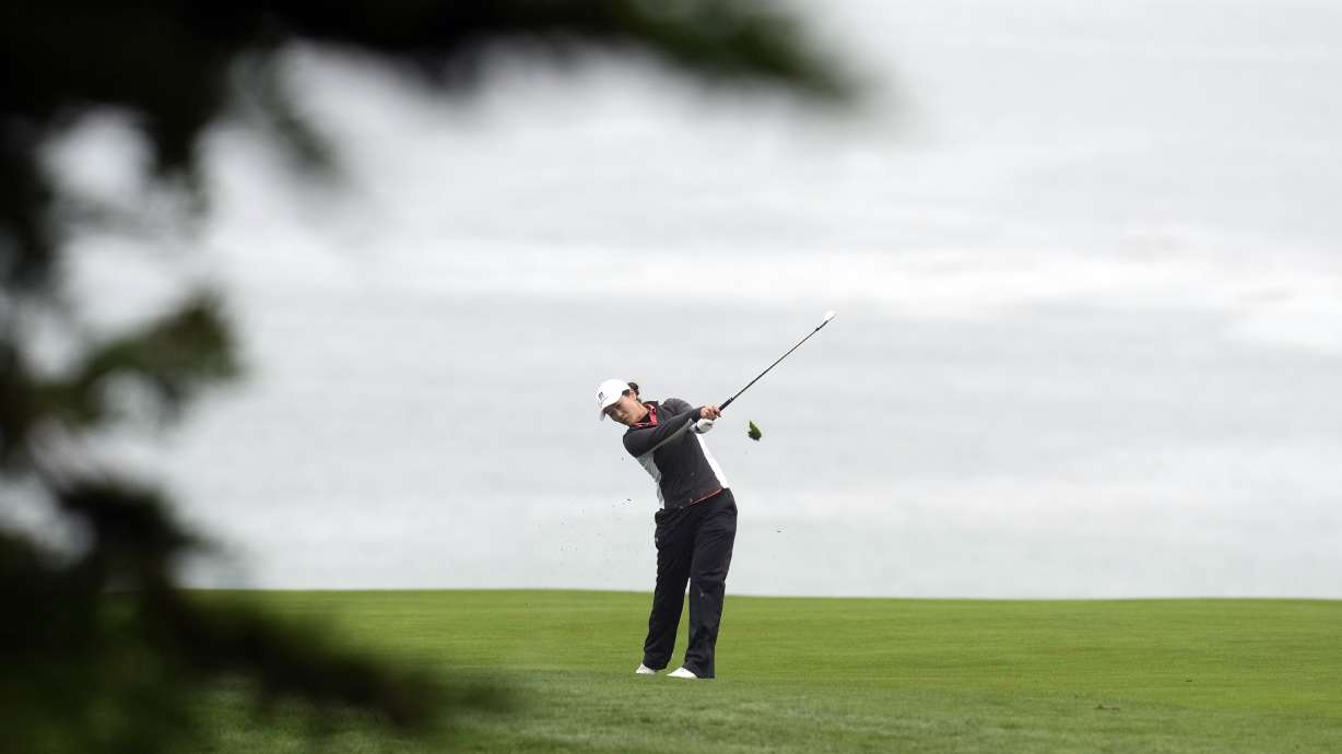 Xiyu Janet Lin, of China, hits from the fairway on the 11th hole during the first round of the U.S. Women's Open golf tournament at the Pebble Beach Golf Links, Thursday, July 6, 2023, in Pebble Beach, Calif.