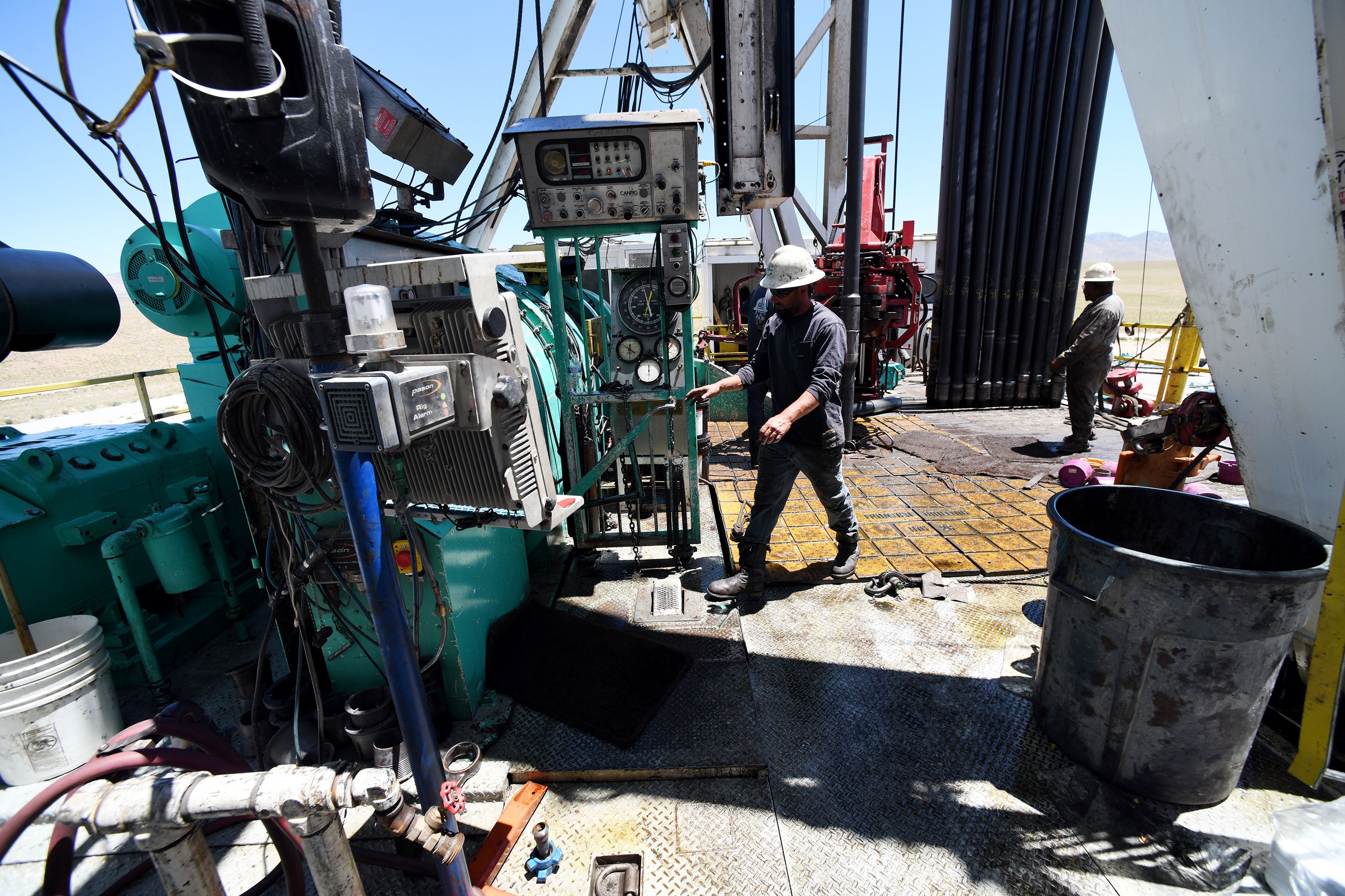 Crew members work on a drilling rig at the FORGE geothermal demonstration sight near Milford on Thursday. Media were given a tour of the facility.