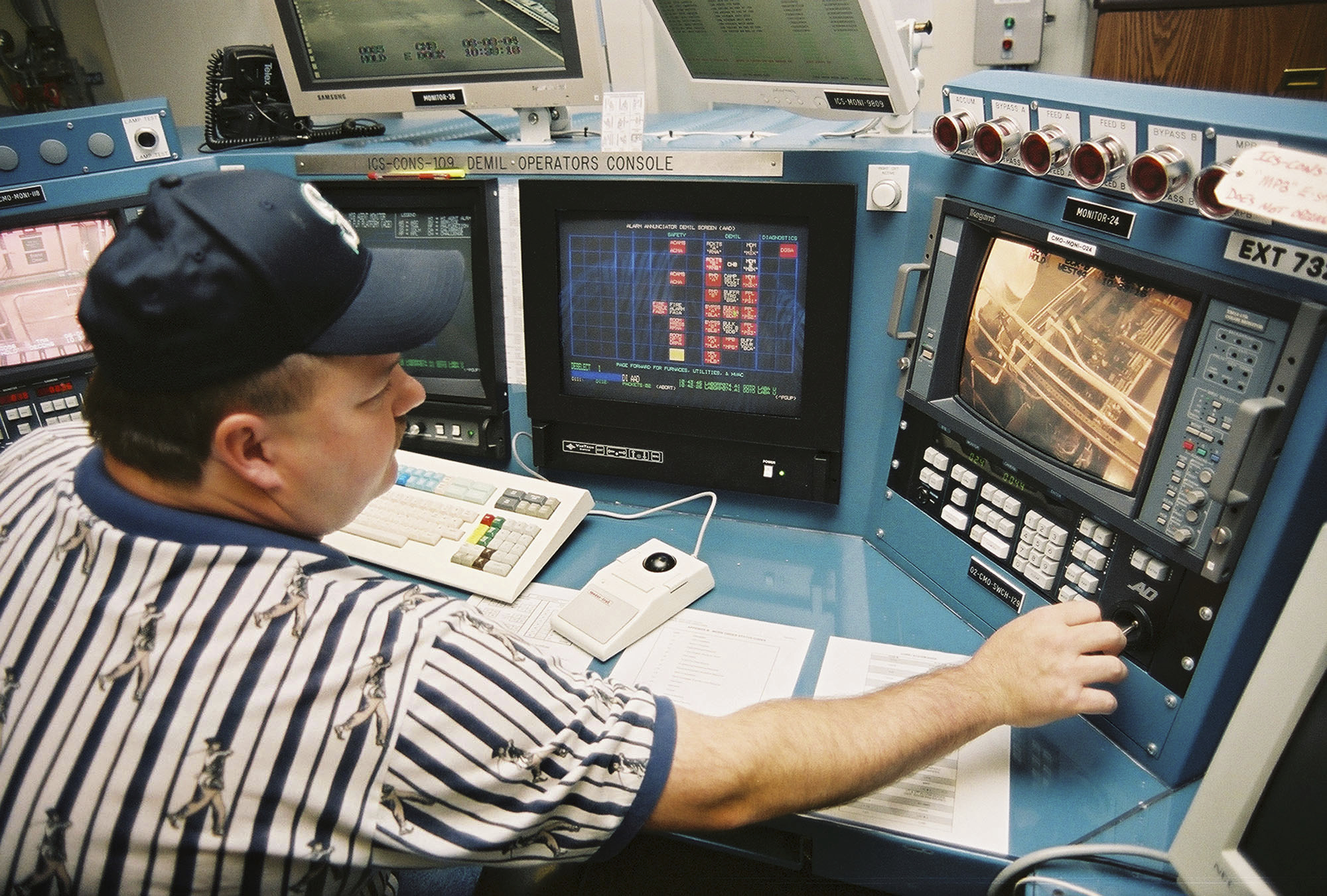 Control room supervisor Lance Pappas consults a video monitor inside the Umatilla Chemical Agent Disposal Facility, June 8, 2004, outside Hermiston, Ore.