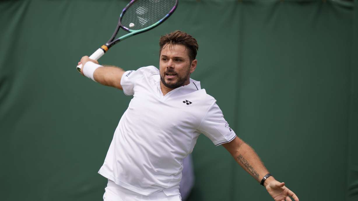 Switzerland's Stan Wawrinka returns to Argentina's Tomas MartÃn Etcheverry in a men's singles match on day four of the Wimbledon tennis championships in London, Thursday, July 6, 2023.
