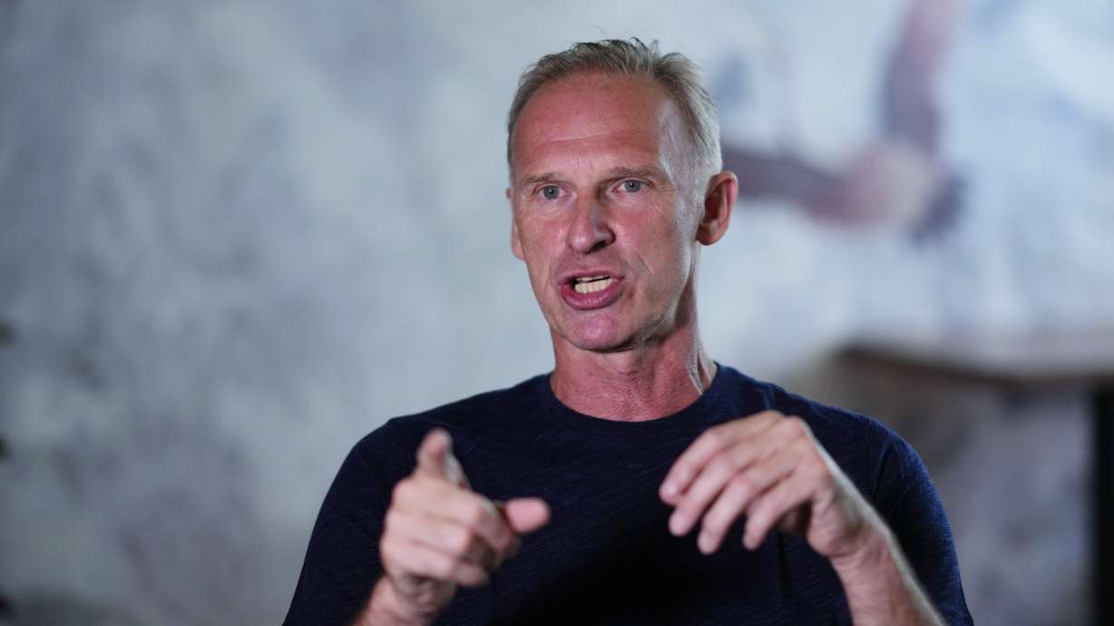 Former NHL goalkeeper Dominik Hasek gestures during an interview with The Associated Press in Prague, Czech Republic, Wednesday, June 28, 2023. The NHL great has been a prominent and vocal critic of the International Olympic Committee's recommendation that Russians and Belarusians could compete in international competitions after being approved as neutrals.