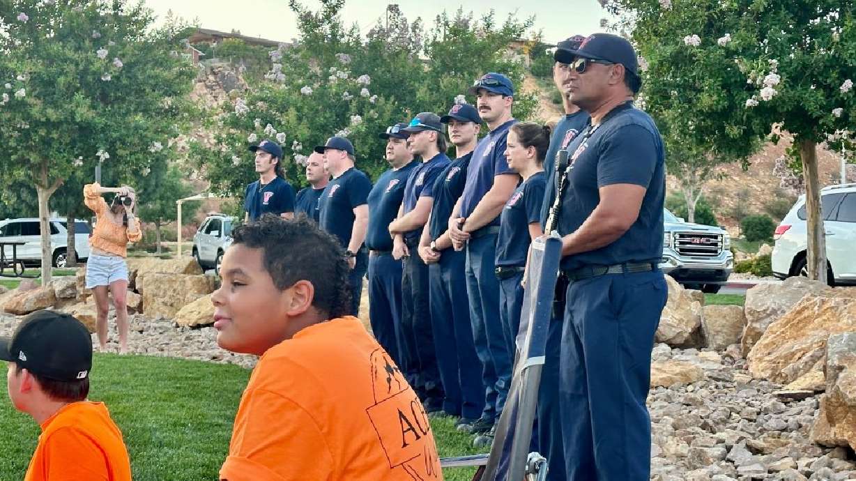 Members of the Washington Fire Department at the candlelight vigil for Ace Butterfus, Washington, Washington County, Wednesday.