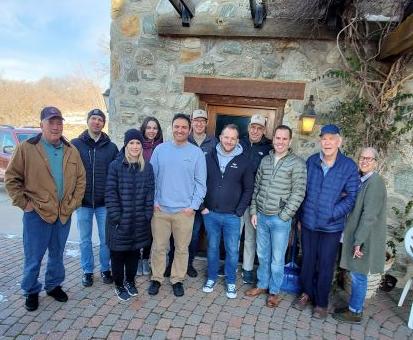 Tom Owens, in a blue hat, stands with his family at the Old Mill in Farmington. He recently sold the property to the city for continued preservation.
