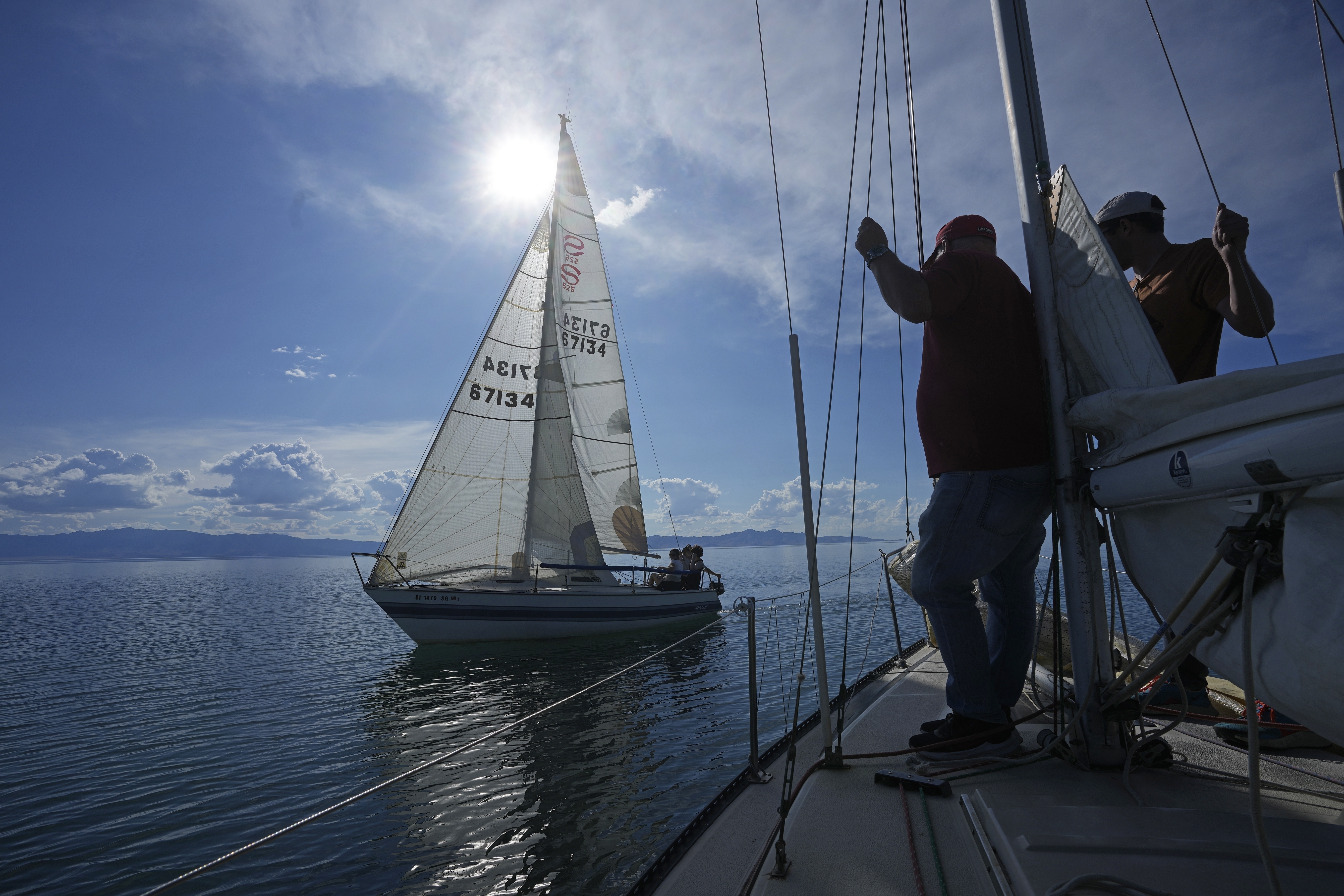 People sail on the Great Salt Lake on June 14, near Magna. Sailors back out on the water are rejoicing after a snowy winter provided a temporary reprieve.