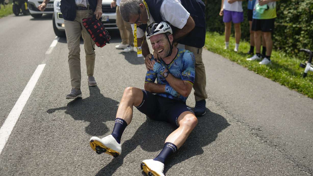 Britain's Mark Cavendish receives medical assistance after crashing during the eighth stage of the Tour de France cycling race over 201 kilometers (125 miles) with start in Libourne and finish in Limoges, France, Saturday, July 8, 2023.