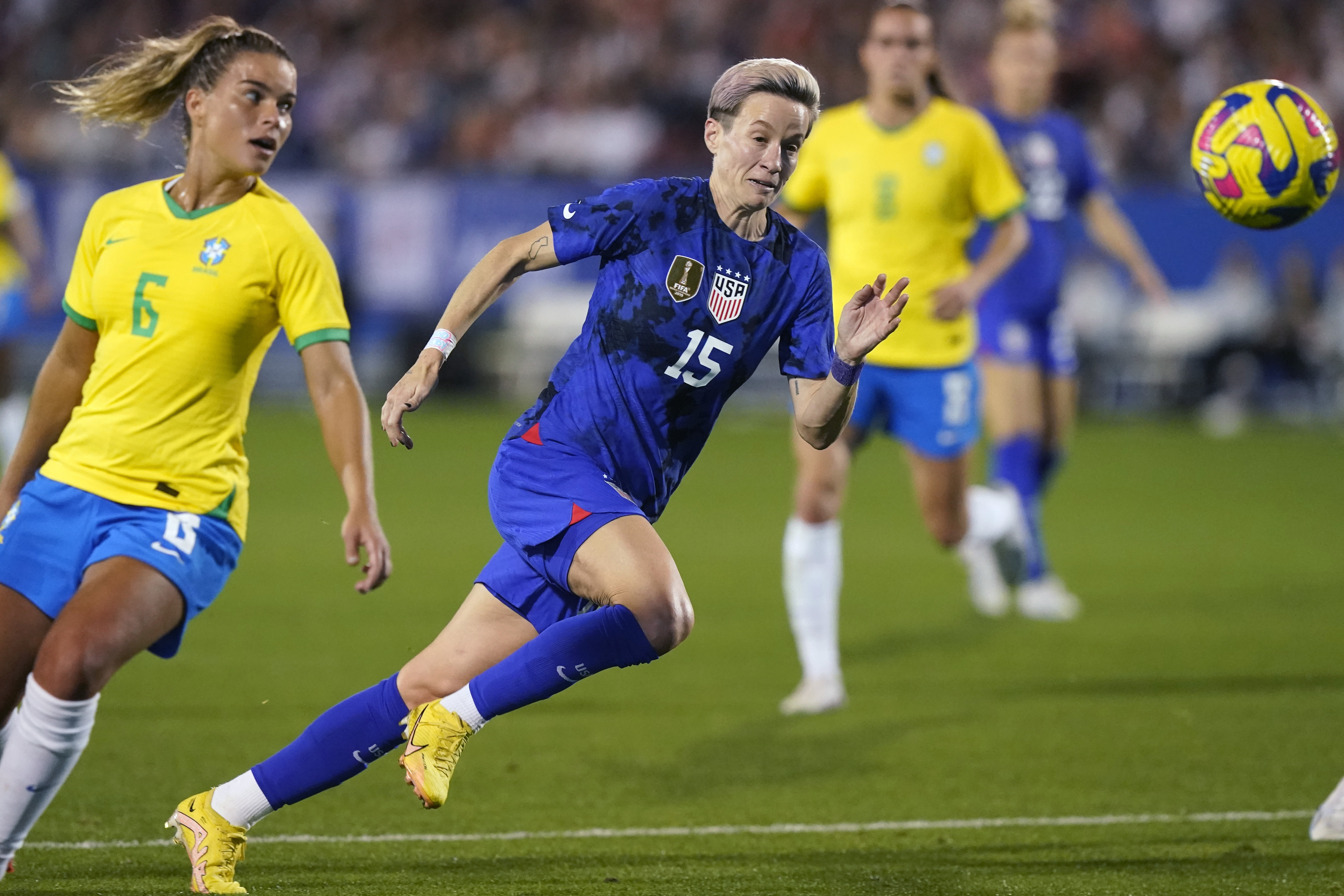FILE - United States forward Megan Rapinoe (15) runs to the ball against Brazil defender Tamires (6) during the second half of a SheBelieves Cup soccer match Wednesday, Feb. 22, 2023, in Frisco, Texas. The United States won 2-0. 