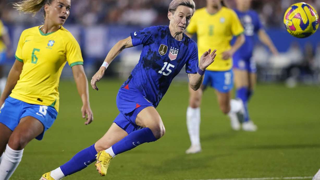 FILE - United States forward Megan Rapinoe (15) runs to the ball against Brazil defender Tamires (6) during the second half of a SheBelieves Cup soccer match Wednesday, Feb. 22, 2023, in Frisco, Texas. The United States won 2-0.