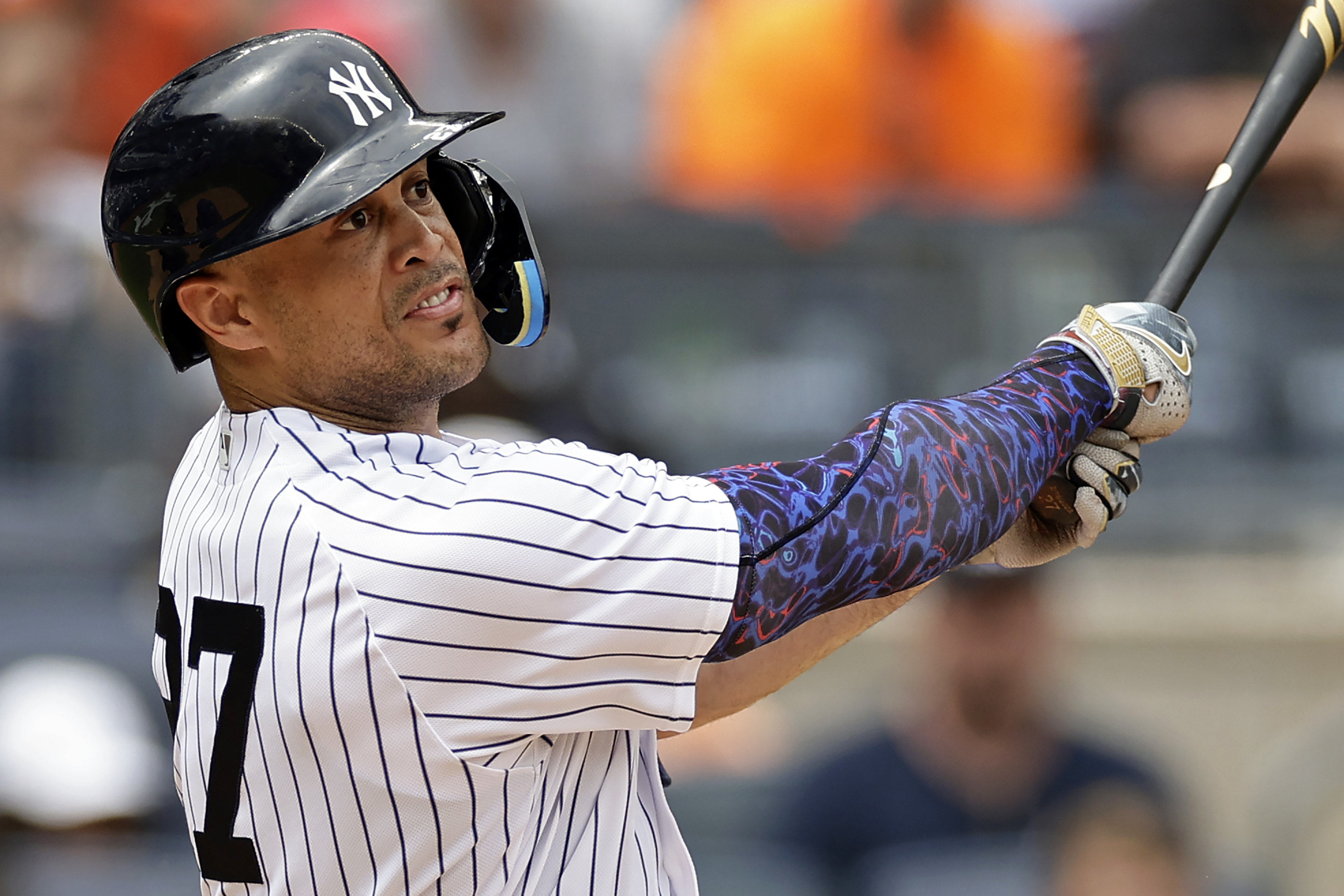 New York Yankees' Giancarlo Stanton hits a two-run home run during the fifth inning of a baseball game against the Chicago Cubs, Saturday, July 8, 2023, in New York.