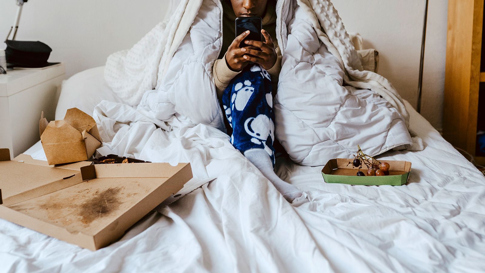 Many TikTok users weighed in on the latest viral self-care term, "bed rotting," in which users post videos of themselves tucked under layers of blankets, oftentimes with a phone or snack in hand.