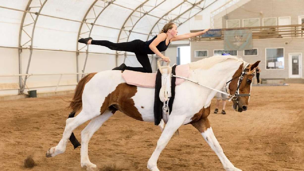 Paityn Phillips practices on horse Clair De Lune during equestrian vaulting practice at Oak Hills Vaulting in Salem on Friday. The team will represent the USA at the FEI Vaulting World Championships for Juniors and Young Vaulters in Sweden.