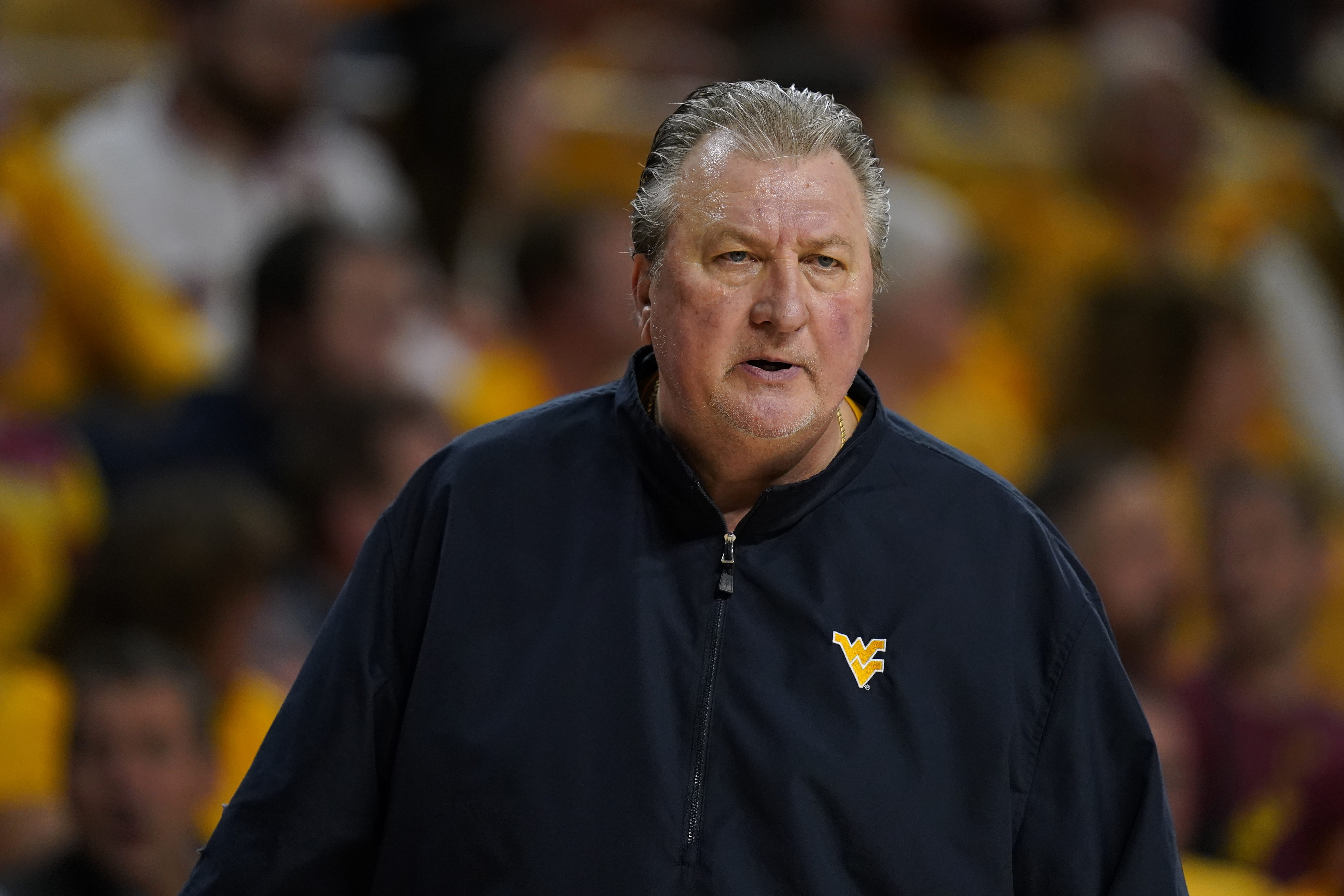 FILE - West Virginia head coach Bob Huggins watches from the bench during the first half of an NCAA college basketball game against Iowa State, Monday, Feb. 27, 2023, in Ames, Iowa. Huggins has been arrested on suspicion of drunken driving, Friday, June 16, a month after the university suspended him for three games for using an anti-gay slur while also denigrating Catholics during a radio interview. 