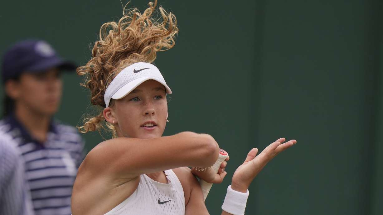 Russia's Mirra Andreeva plays a return to Russia's Anastasia Potapova during the women's singles match on day seven of the Wimbledon tennis championships in London, Sunday, July 9, 2023.