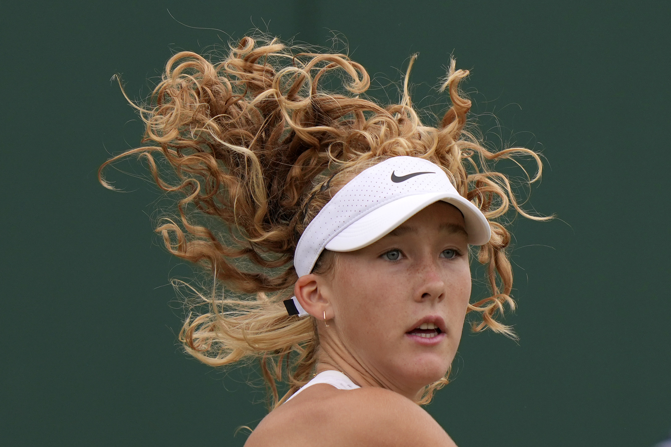 Russia's Mirra Andreeva plays a return to Russia's Anastasia Potapova during the women's singles match on day seven of the Wimbledon tennis championships in London, Sunday, July 9, 2023. 