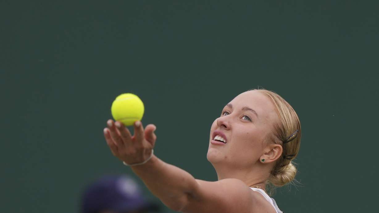Russia's Anastasia Potapova serves to Russia's Mirra Andreeva during the women's singles match on day seven of the Wimbledon tennis championships in London, Sunday, July 9, 2023.