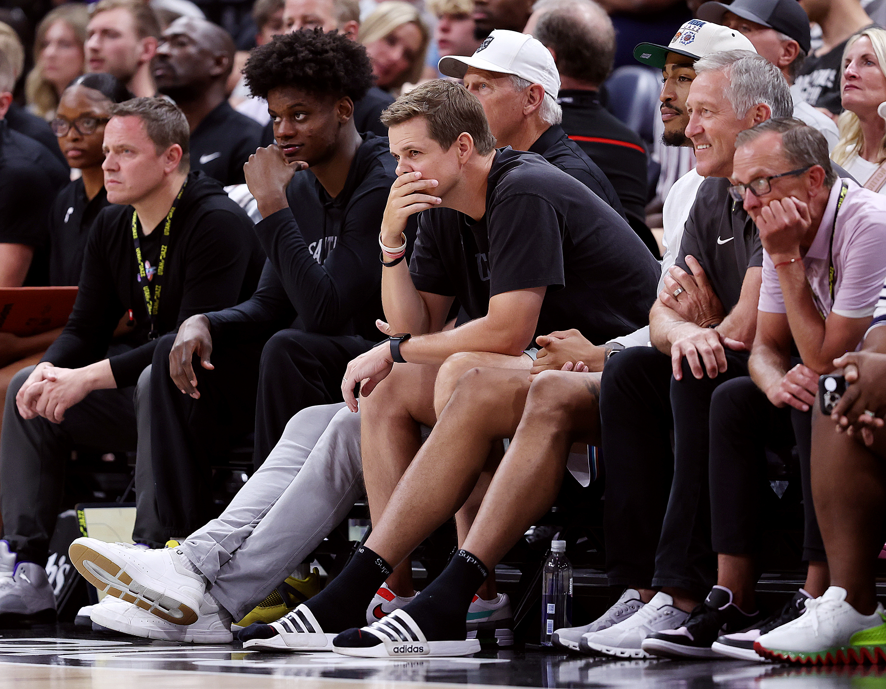 Jazz head coach Will Hardy sits with John Collins and team officials as the Utah Jazz and Philadelphia 76ers play in Summer League action at the Delta Center in Salt Lake City on Wednesday, July 5, 2023.