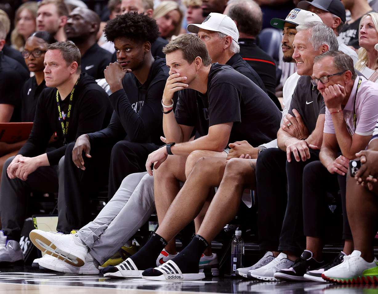 Jazz head coach Will Hardy sits with John Collins and team officials as the Utah Jazz and Philadelphia 76ers play in Summer League action at the Delta Center in Salt Lake City on Wednesday, July 5, 2023.