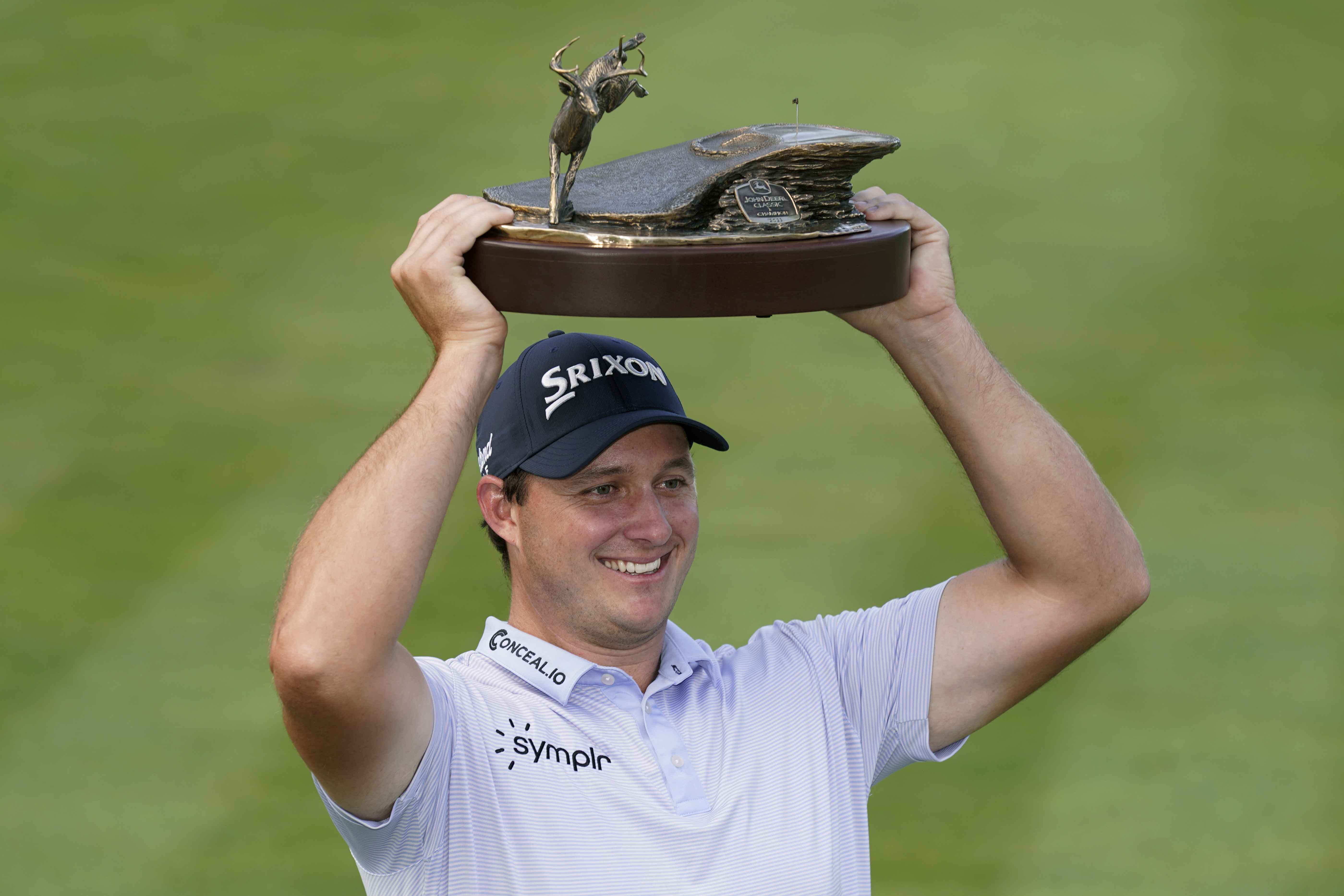 Sepp Straka, of Austria, holds the trophy after winning the John Deere Classic golf tournament, Sunday, July 9, 2023, at TPC Deere Run in Silvis, Ill. 