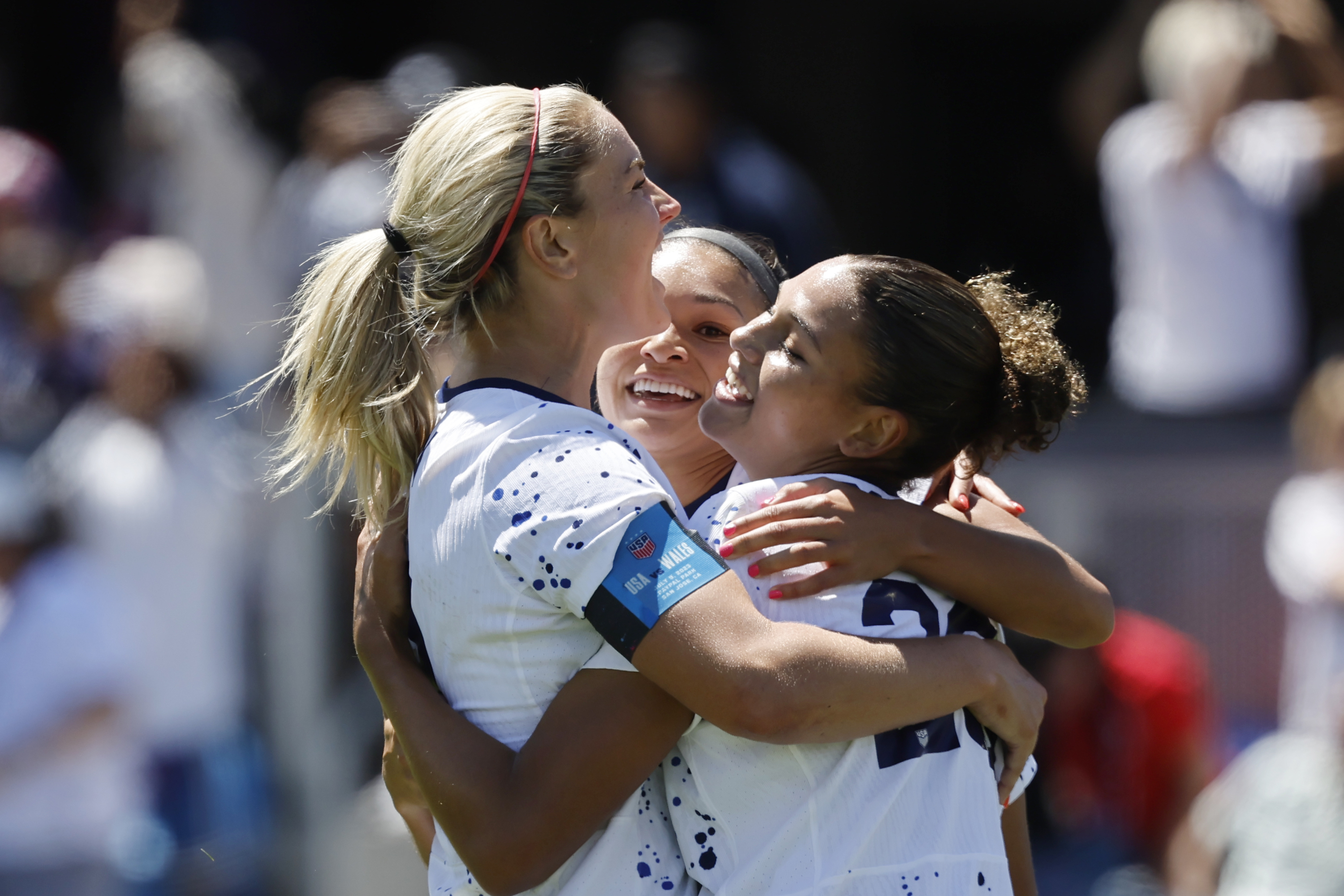 United States midfielder Lindsey Horan, left, and Sophia Smith, center, celebrate with forward Trinity Rodman, right, who scored in the second half of a FIFA Women's World Cup send-off soccer match against Wales in San Jose, Calif., Sunday, July 9, 2023. 