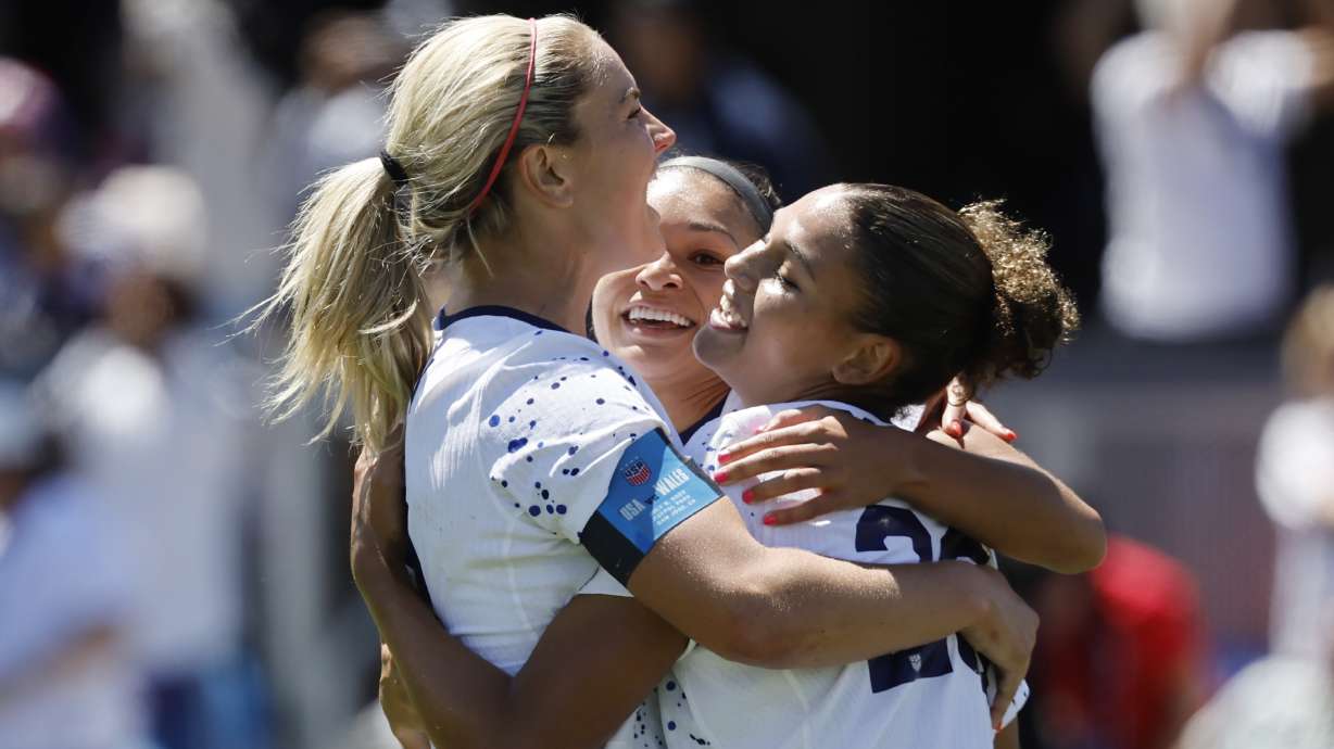 United States midfielder Lindsey Horan, left, and Sophia Smith, center, celebrate with forward Trinity Rodman, right, who scored in the second half of a FIFA Women's World Cup send-off soccer match against Wales in San Jose, Calif., Sunday, July 9, 2023.