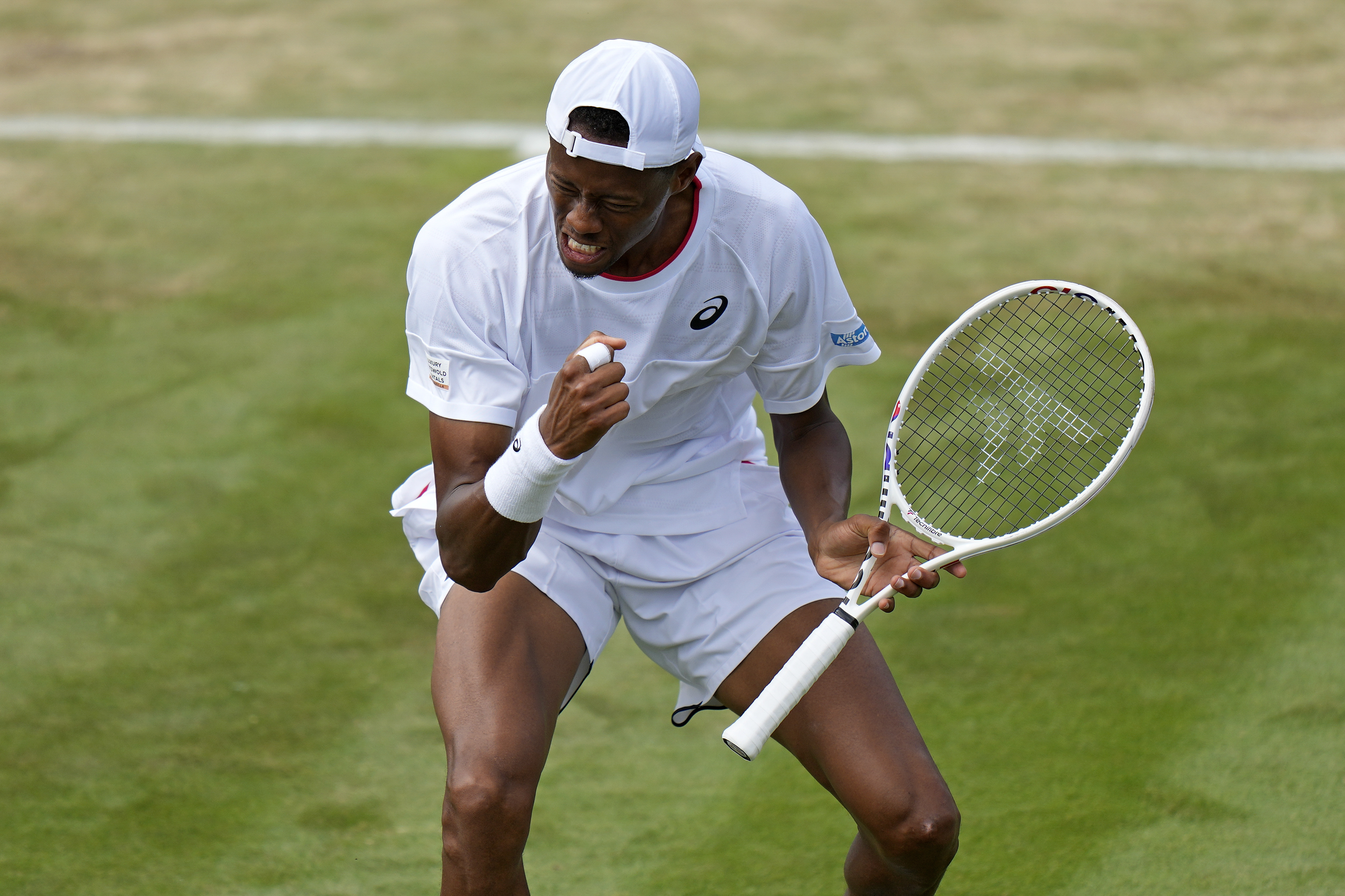 Christopher Eubanks of the US celebrates winning a point against Stefanos Tsitsipas of Greece in a men's singles match on day eight of the Wimbledon tennis championships in London, Monday, July 10, 2023.