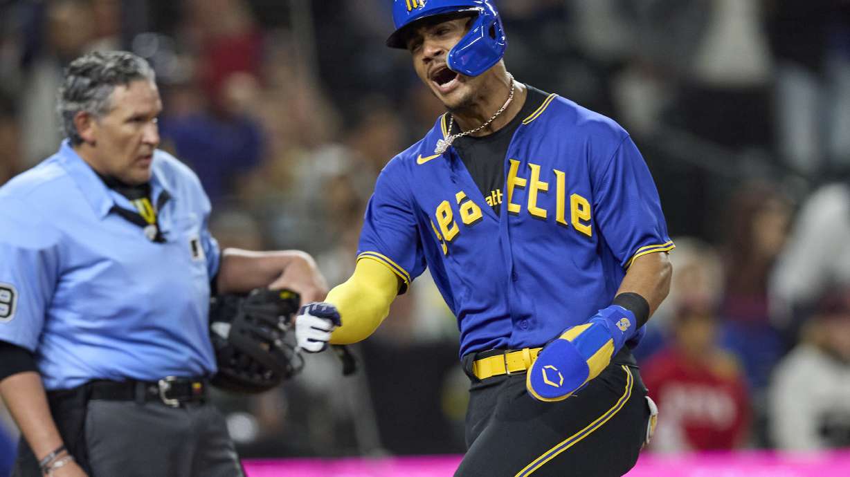 Seattle Mariners' Julio Rodriguez celebrates as scores on a double by Teoscar Hernandez against the Chicago White Sox during the fifth inning of a baseball game Friday, June 16, 2023, in Seattle.