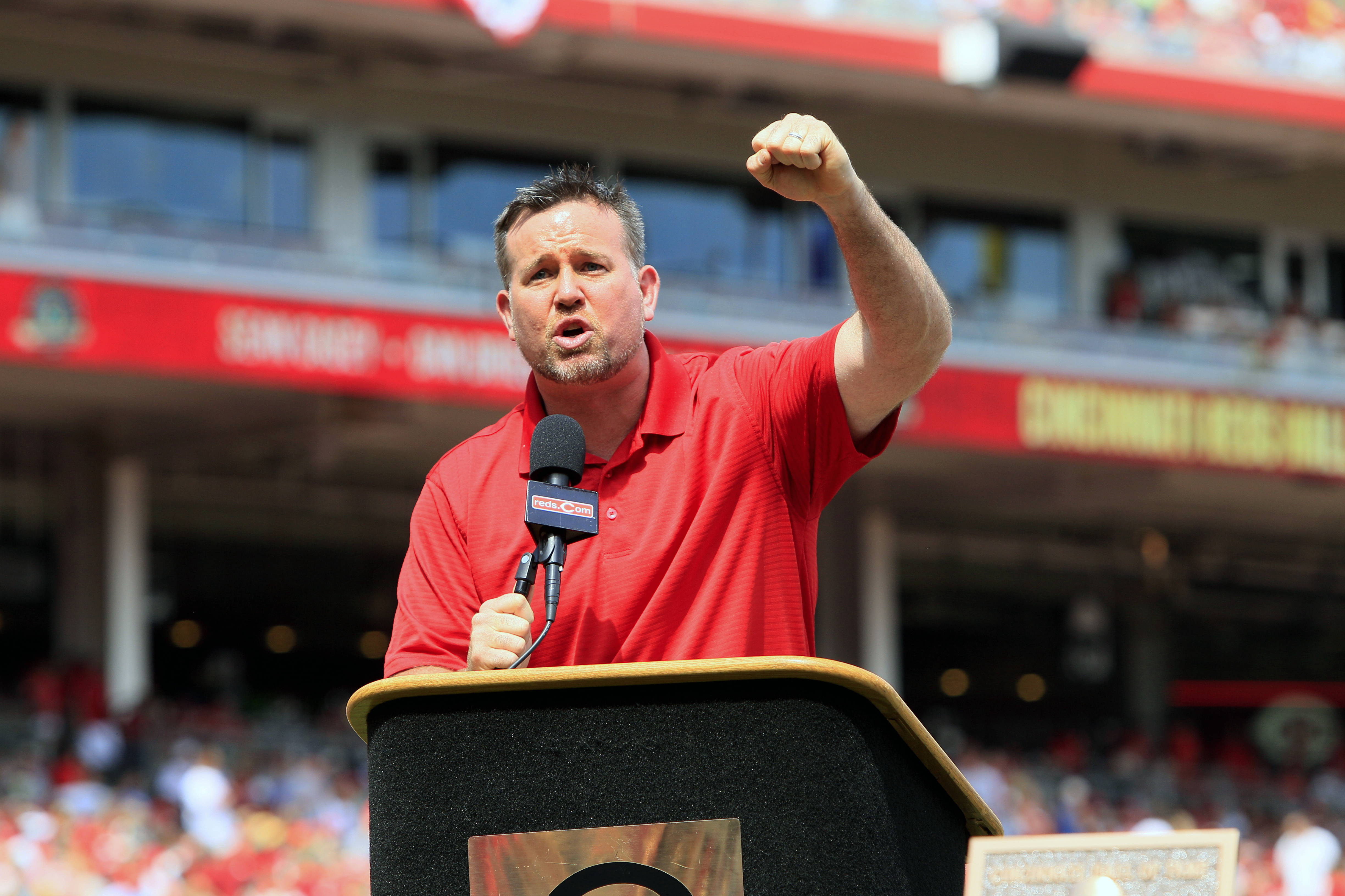 FILE - Former Cincinnati Reds first baseman Sean Casey speaks during ceremonies enshrining him into the team's Hall of Fame prior to a baseball game between the Cincinnati Reds and the Minnesota Twins, Saturday, June 23, 2012, in Cincinnati. The New York Yankees have hired 12-year big league veteran Sean Casey as their hitting coach for the remainder of this season, a person with knowledge of the situation told The Associated Press. The person spoke to the AP on condition of anonymity because the deal has not been formally announced. Casey, 49, has been working for MLB Network as an analyst.