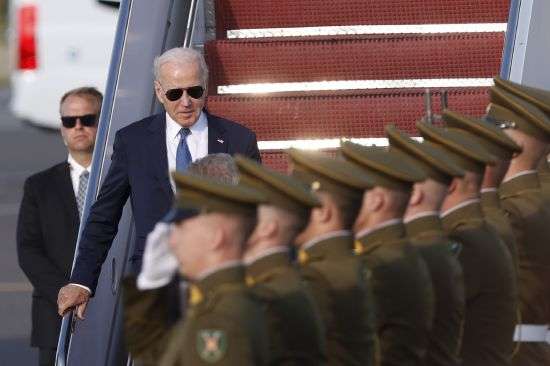 U.S. President Joe Biden, center, arrives at Vilnius airport ahead of a NATO summit in Vilnius, Lithuania, Monday. Russia's war on Ukraine will top the agenda when NATO leaders meet in the Lithuanian capital Vilnius on Tuesday and Wednesday.