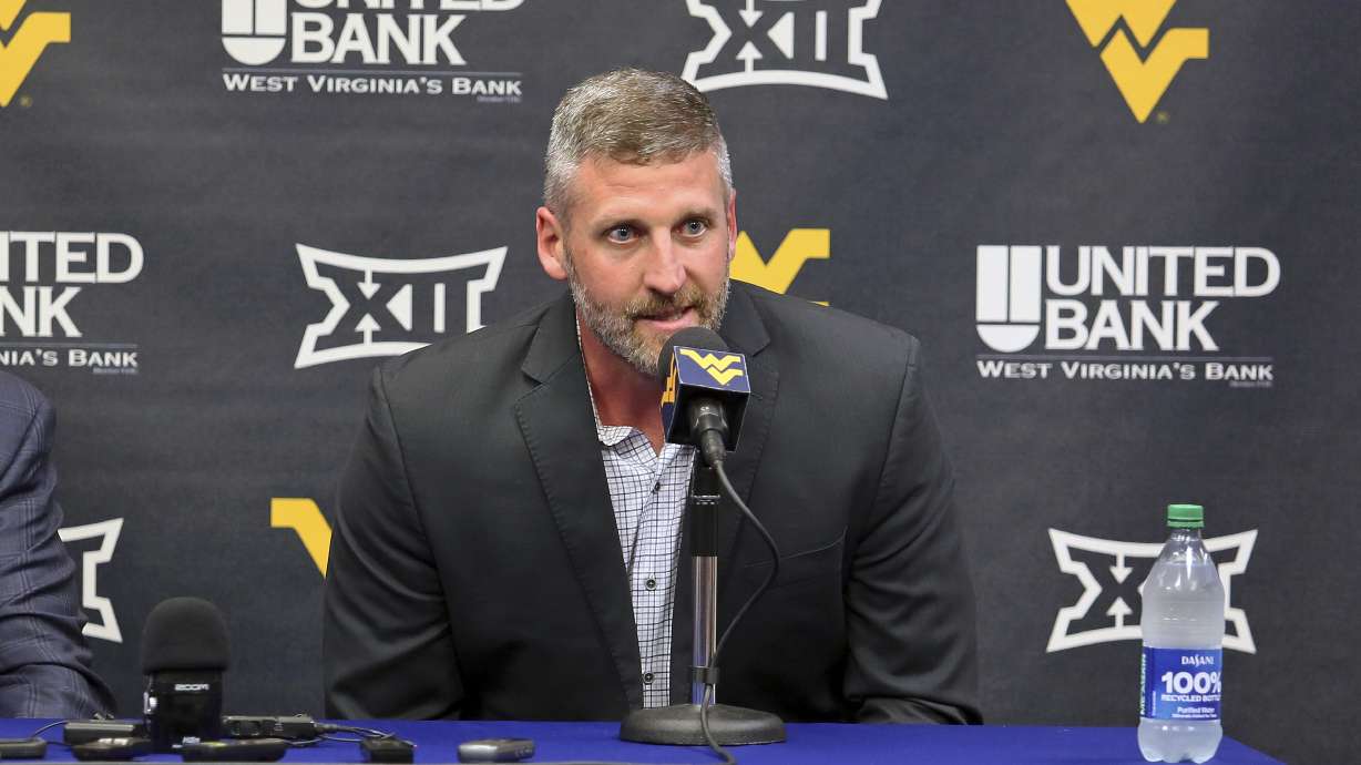 West Virginia interim NCAA college basketball coach Josh Eilert answers questions during a news conference, Monday, June 26, 2023, in Morgantown, W.Va.