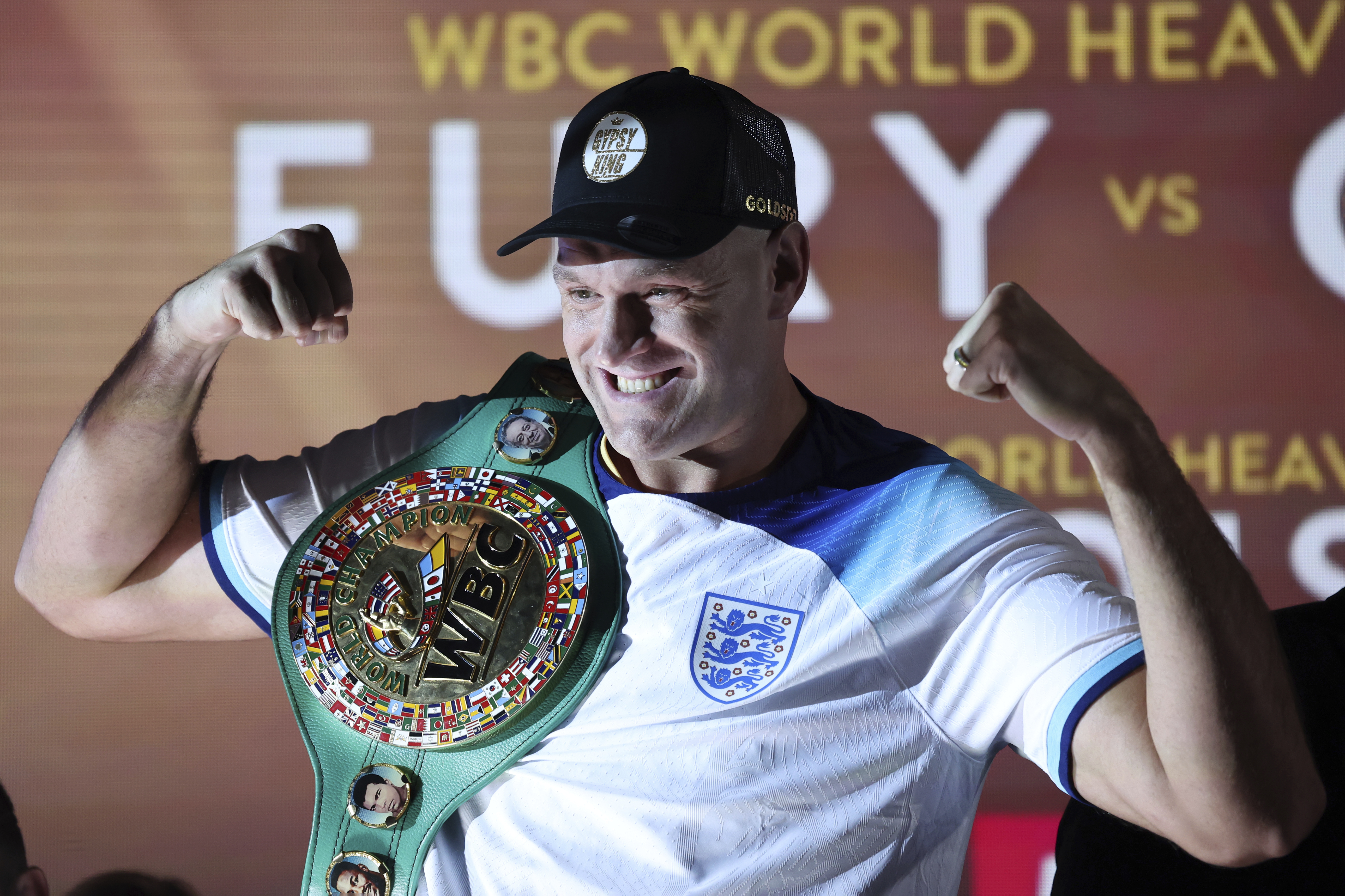 FILE - WBC heavyweight boxing champion Tyson Fury poses with his championship belt after the official weigh-in for his fight against Derek Chisora, in London, Friday Dec. 2, 2022. Boxing heavyweight champion Tyson Fury and former UFC heavyweight champion Francis Ngannou will fight in a boxing bout Oct. 28 in Saudi Arabia, the promoter Top Rank announced Tuesday, July 11, 2023. 