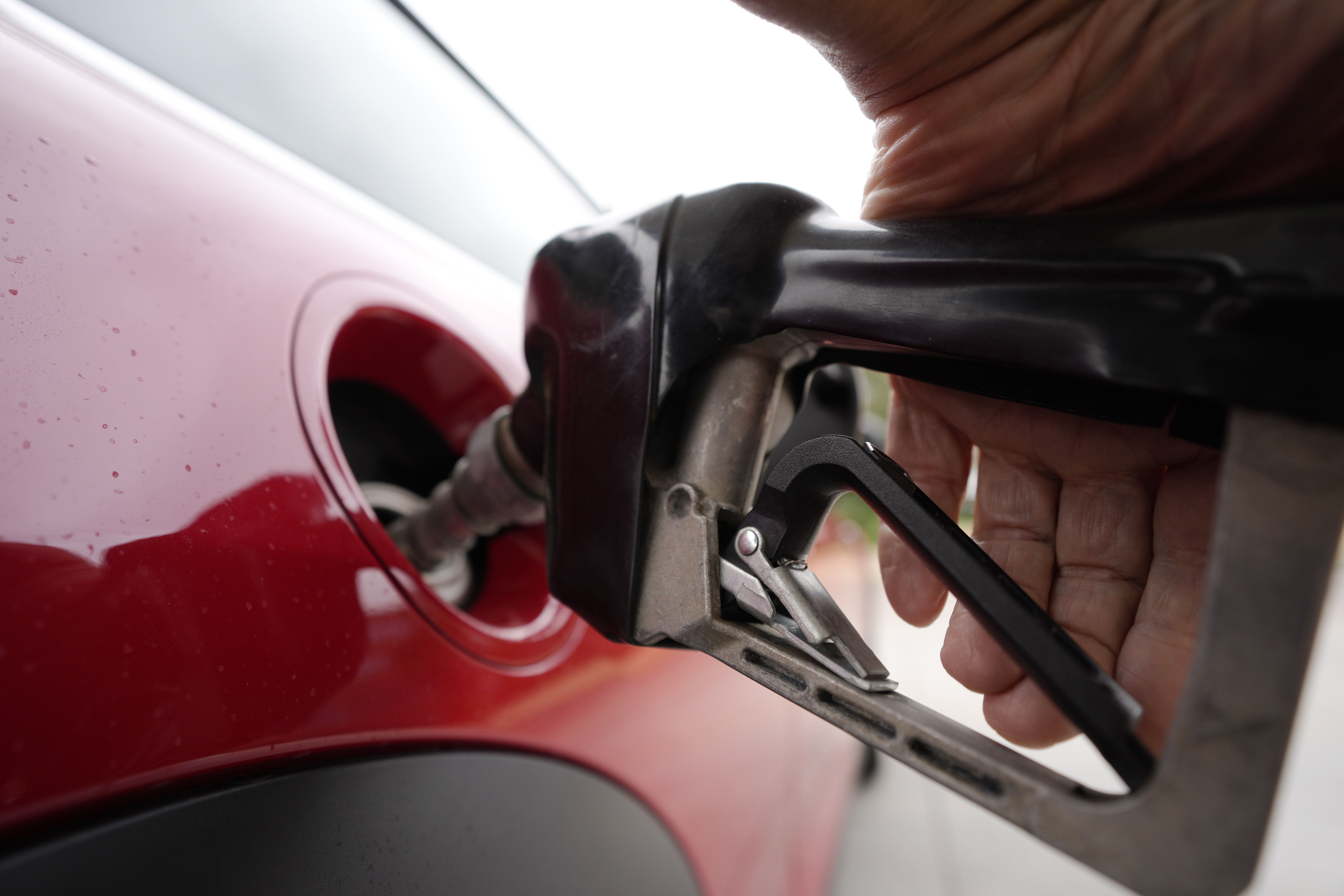 A motorist pumps fuel at a Shell station July 5, in Englewood, Colo.