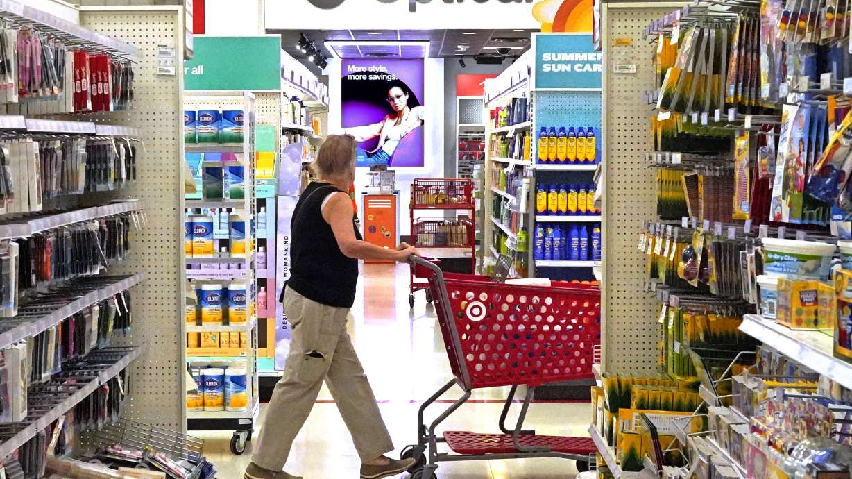 A shopper looks down an aisle in a Target store in Upper Saint Clair, Pa., on July 7. On Wednesday, the Labor Department said U.S. inflation fell to 3% in June.