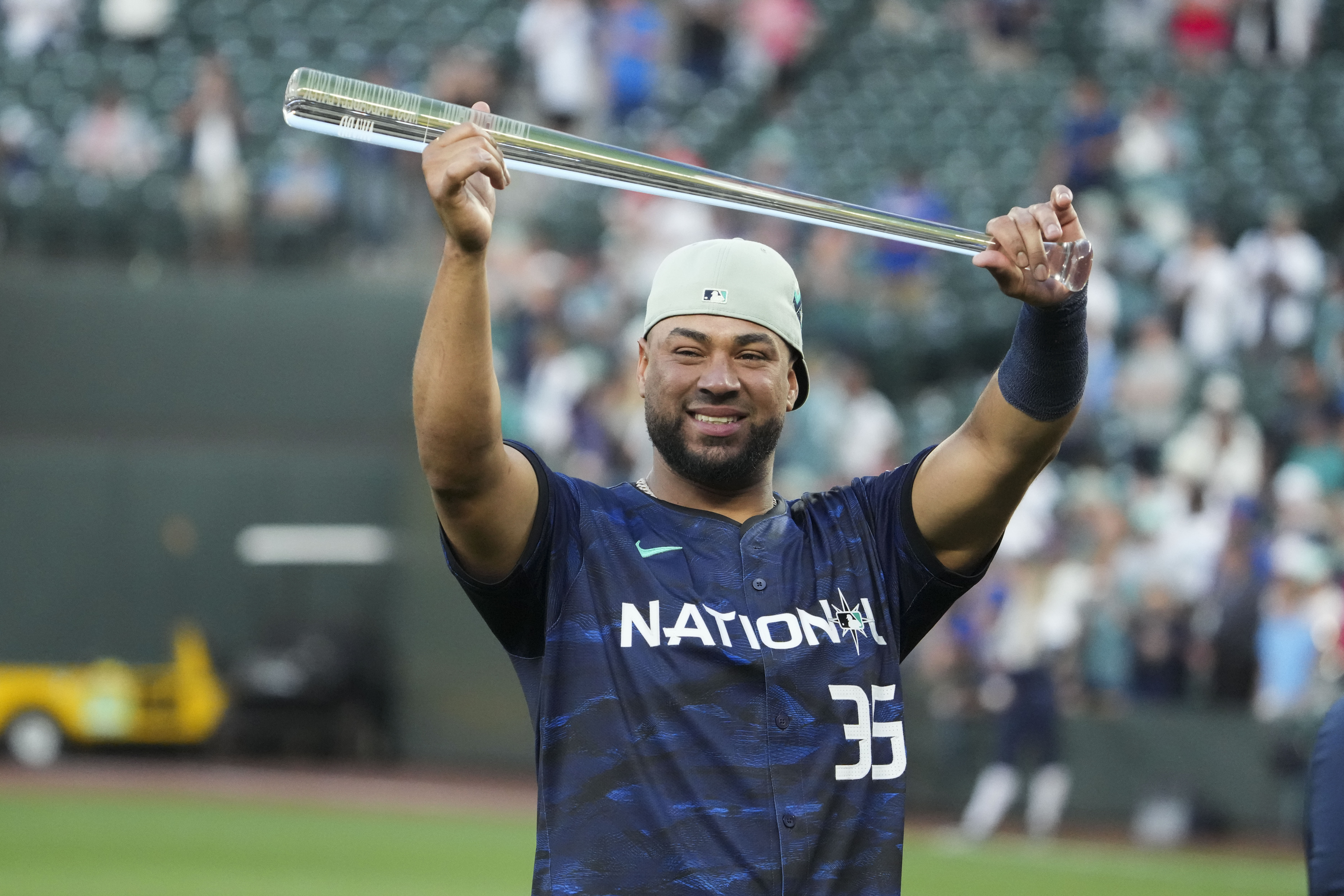 National League's Elias Díaz (35), of the Colorado Rockies, holds up his MVP award after the MLB All-Star baseball game in Seattle, Tuesday, July 11, 2023. The National League won 3-2. 