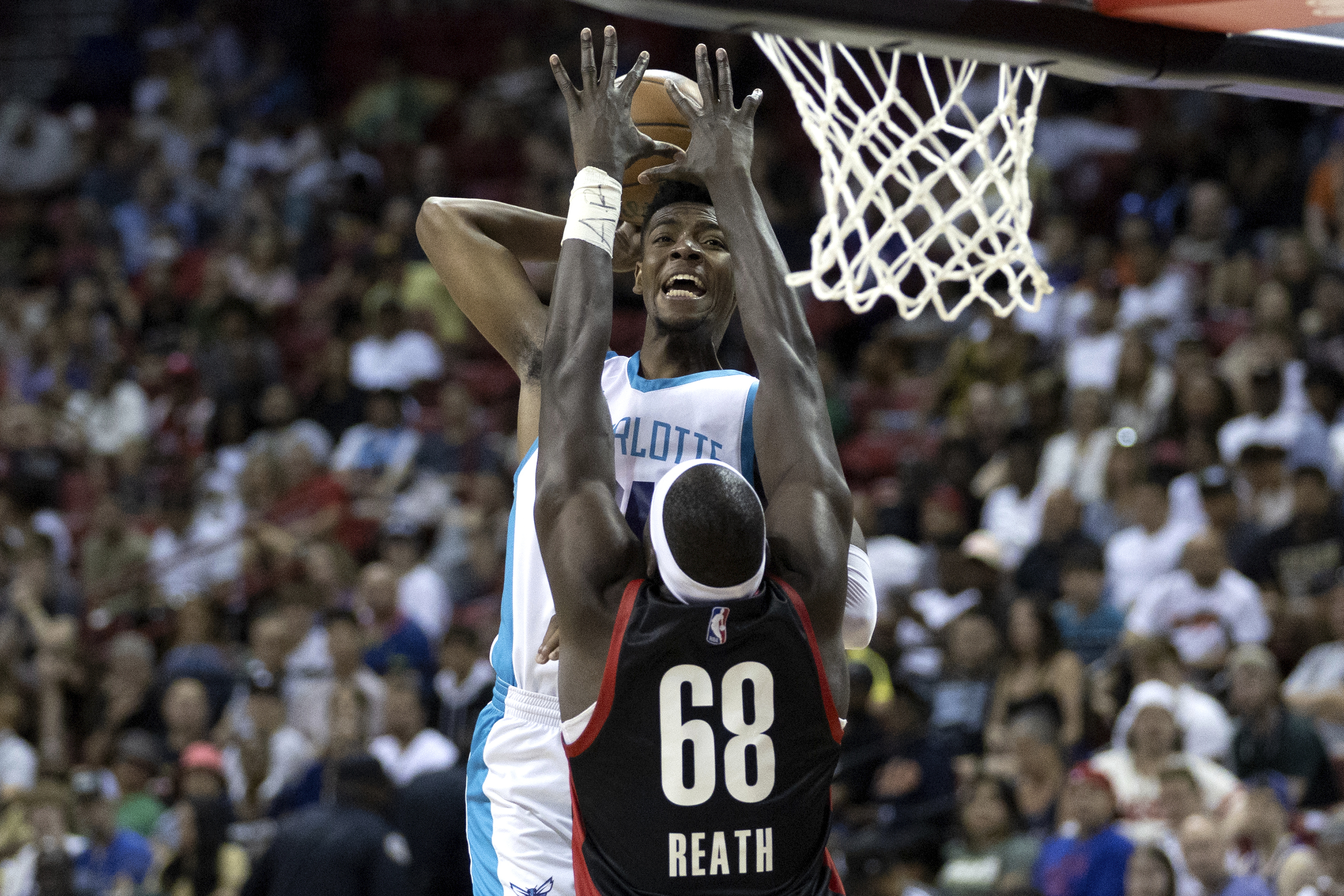 Charlotte Hornets forward Brandon Miller shoots against Portland Trail Blazers center Duop Reath (68) during an NBA summer league basketball game Tuesday, July 11, 2023, in Las Vegas.