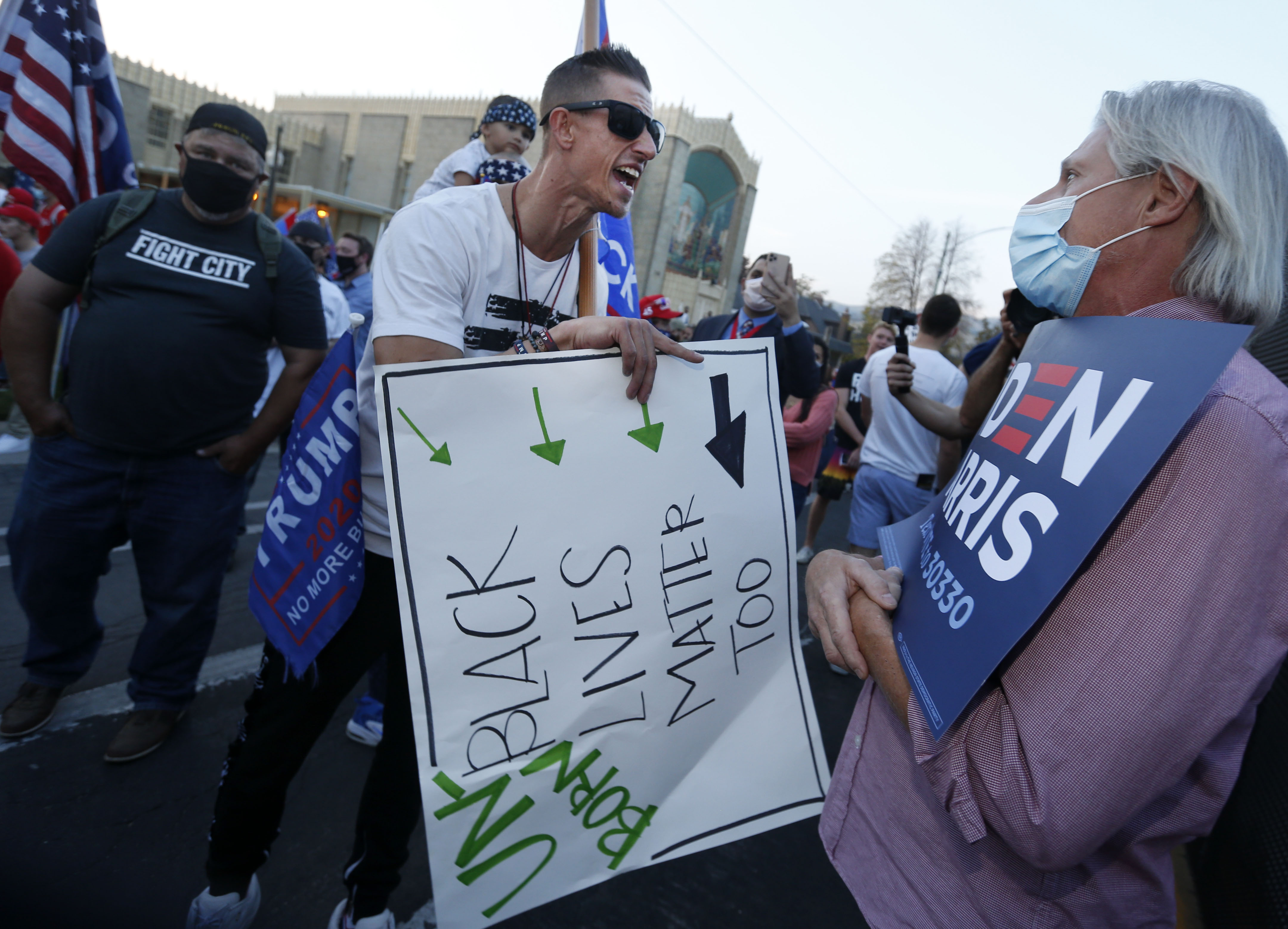 A Trump supporter and a Biden supporter argue prior to the vice presidential debate at the University of Utah in Salt Lake City on Oct. 7, 2020. A recent Utah Valley University study found a high level of partisan polarization in Utah.