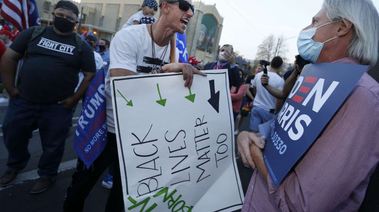 A Trump supporter and a Biden supporter argue prior to the vice presidential debate at the University of Utah in Salt Lake City on Oct. 7, 2020. A recent Utah Valley University study found a high level of partisan polarization in Utah.