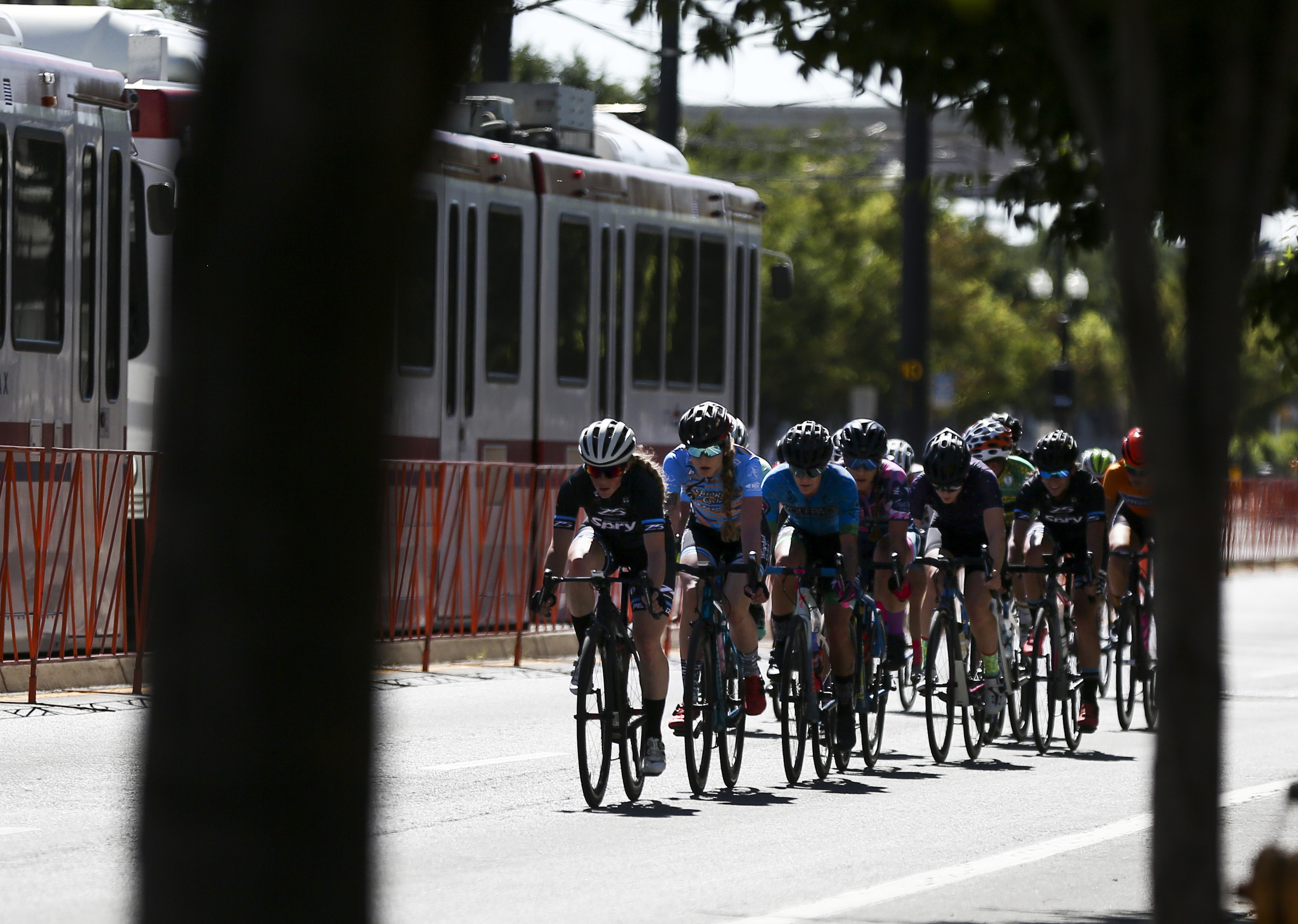 Riders in the women's category race down 200 South during the Salt Lake Criterium at The Gateway in Salt Lake City on July 20, 2019. The pro event returns this weekend with races on Saturday and Sunday across the city.