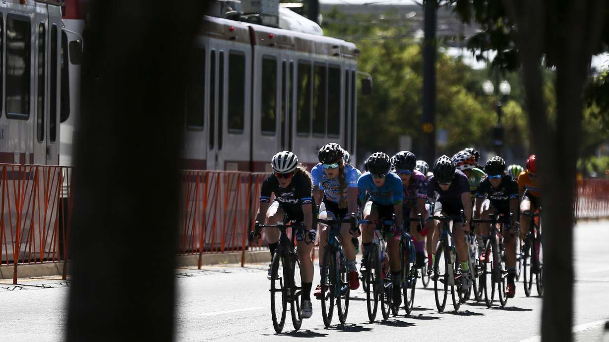 Riders in the women's category race down 200 South during the Salt Lake Criterium at The Gateway in Salt Lake City on July 20, 2019. The pro event returns this weekend with races on Saturday and Sunday across the city.