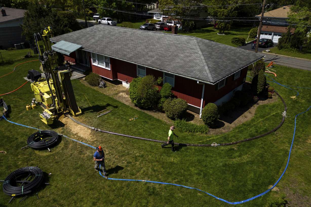 A drill rig for a geothermal heat pump sits outside a home in White Plains, N.Y., May 8. A water-filled loop installed several hundred feet deep in your yard is used to either carry heat away from or into the house, depending on the season. Industry experts see the technology becoming increasingly popular in the coming years.