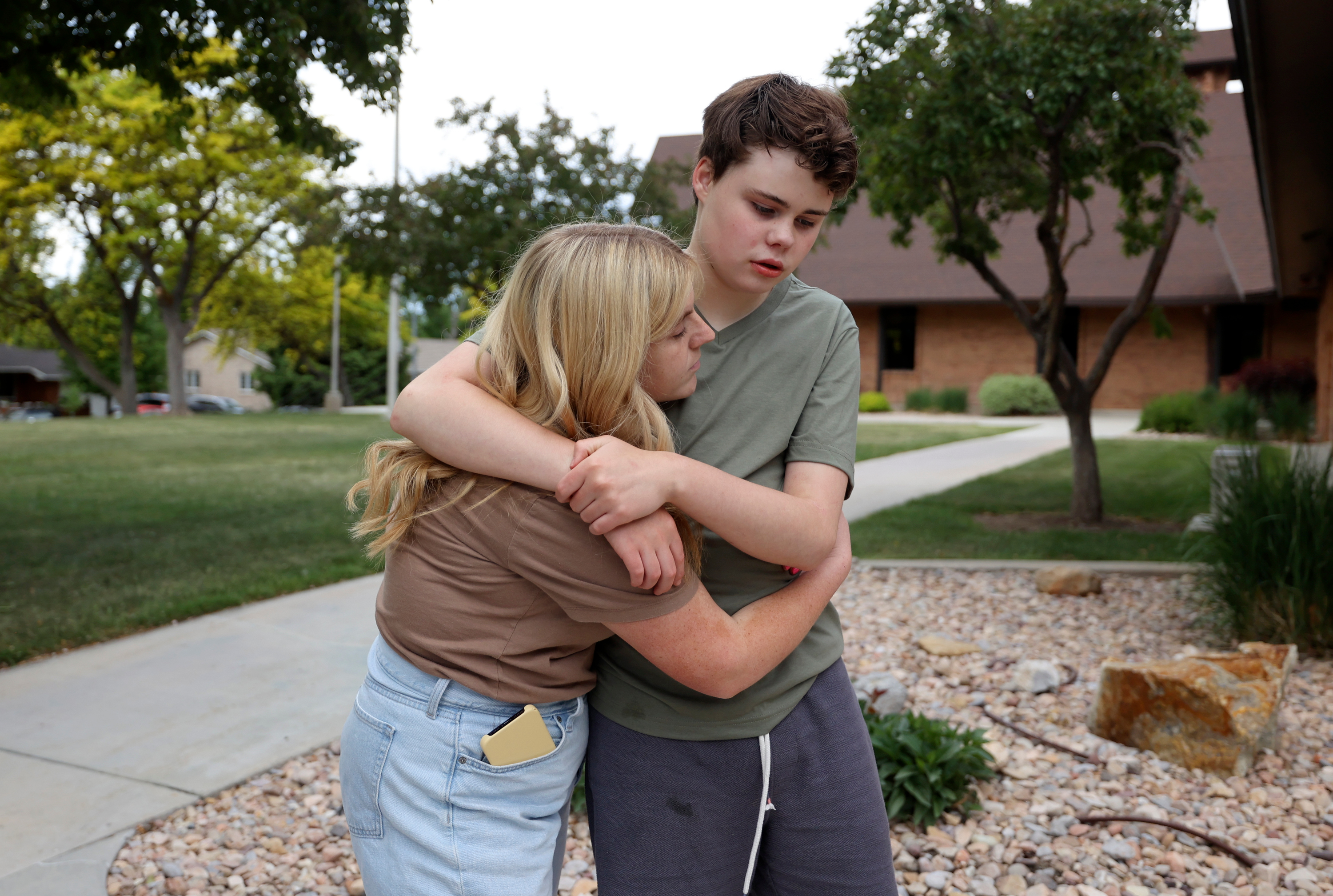 Caregiver Millie Mecham hugs Conner Campbell, 16, outside a church near Campbell’s home in Provo on May 28. Campbell is autistic, nonverbal and has epilepsy. Here's what the Legislature did and didn't do to support Utah caregivers this year. 