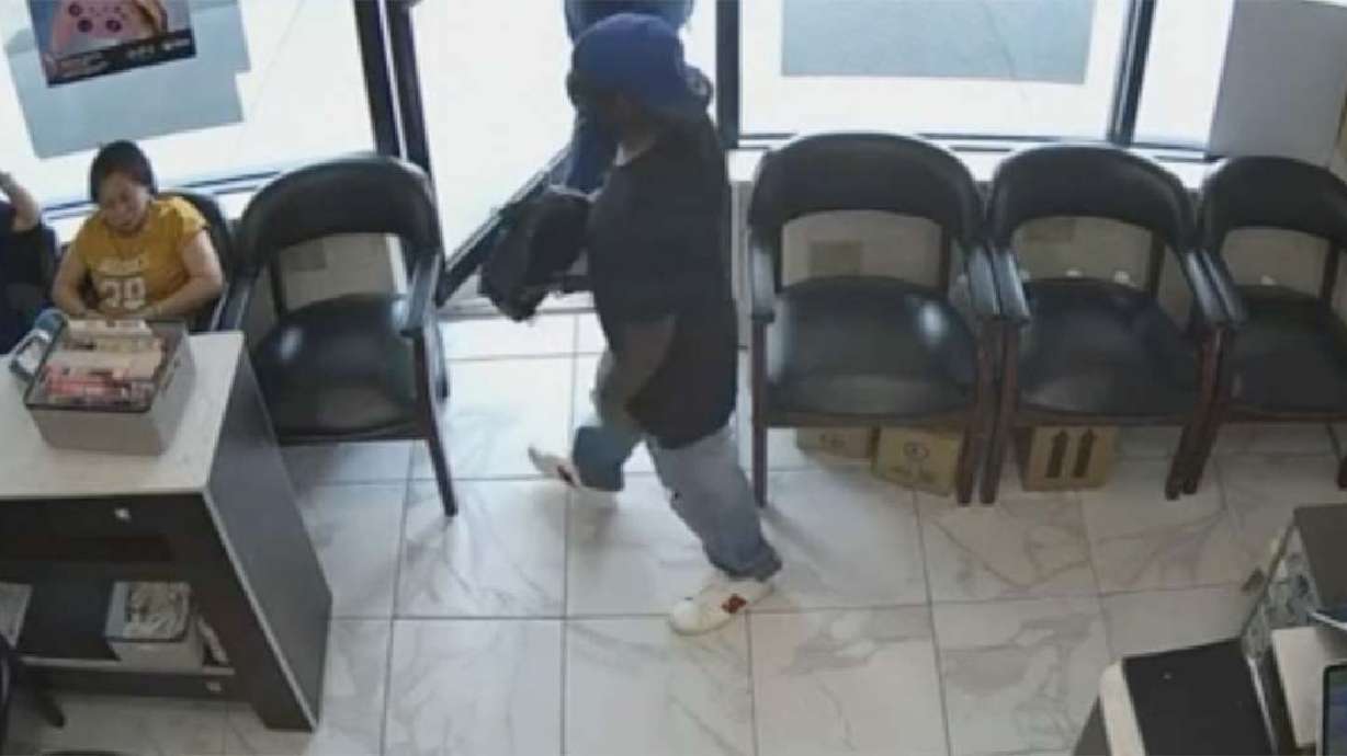 Video shows a would-be robber at an Atlanta nail salon July 3.