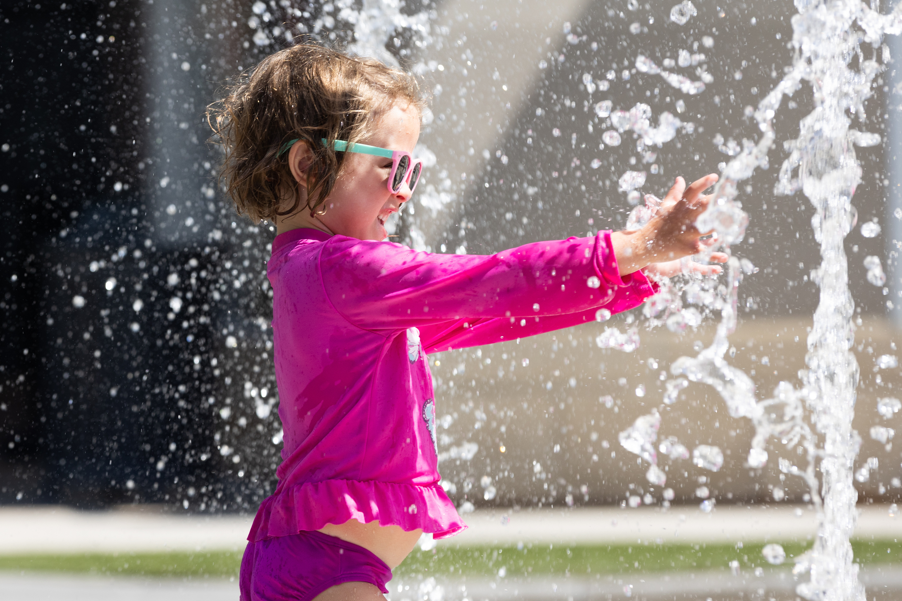 Sydney Wittenbrook, 5, plays at the splash pad at The Gateway in Salt Lake City on Thursday. The upcoming forecast warns of excessive heat.
