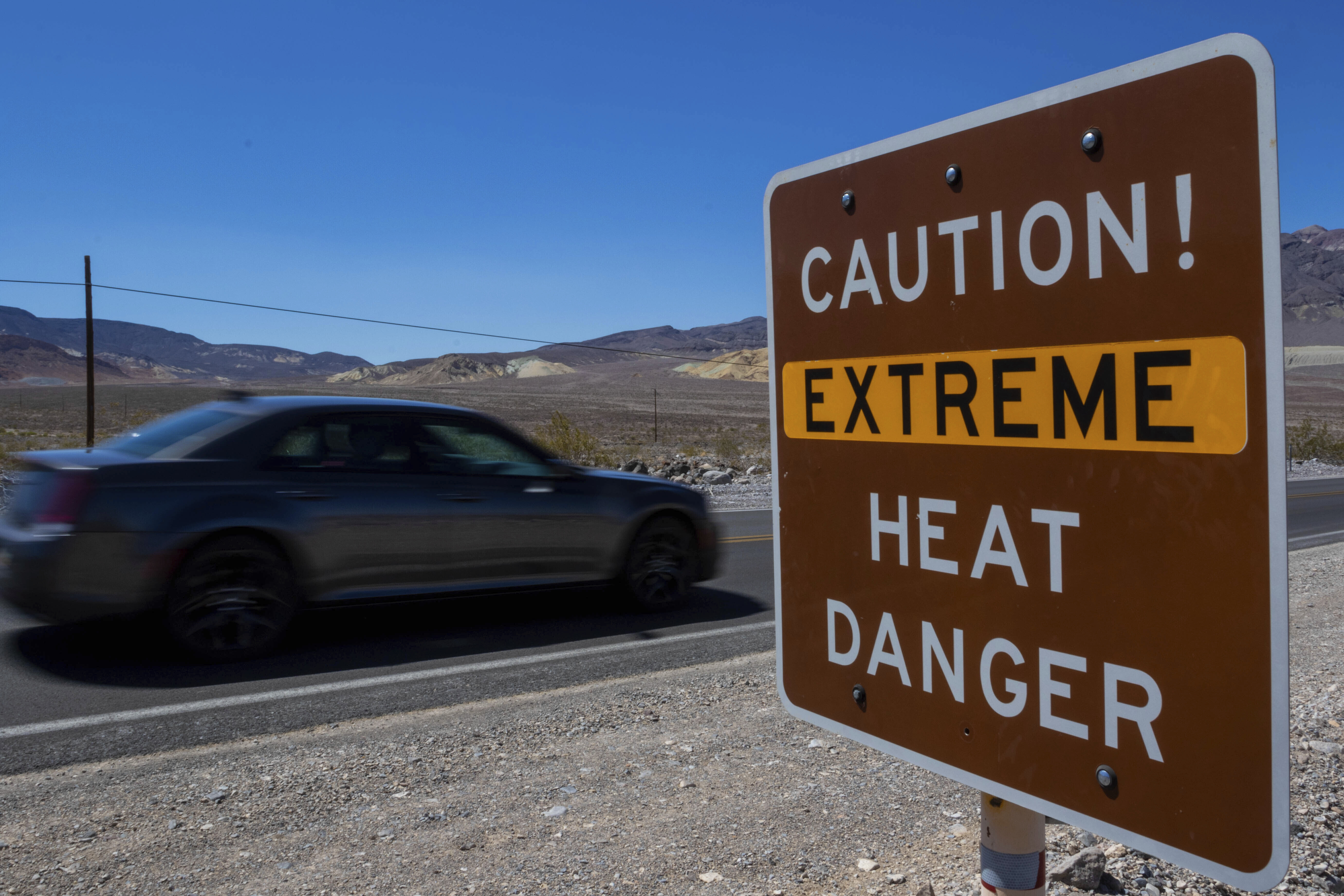 A sign warns of extreme heat Tuesday in Death Valley National Park, Calif. July is the hottest month at the park with an average high of 116 degrees. 