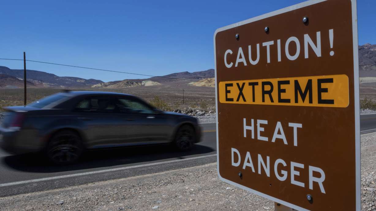 A sign warns of extreme heat Tuesday in Death Valley National Park, Calif. July is the hottest month at the park with an average high of 116 degrees.