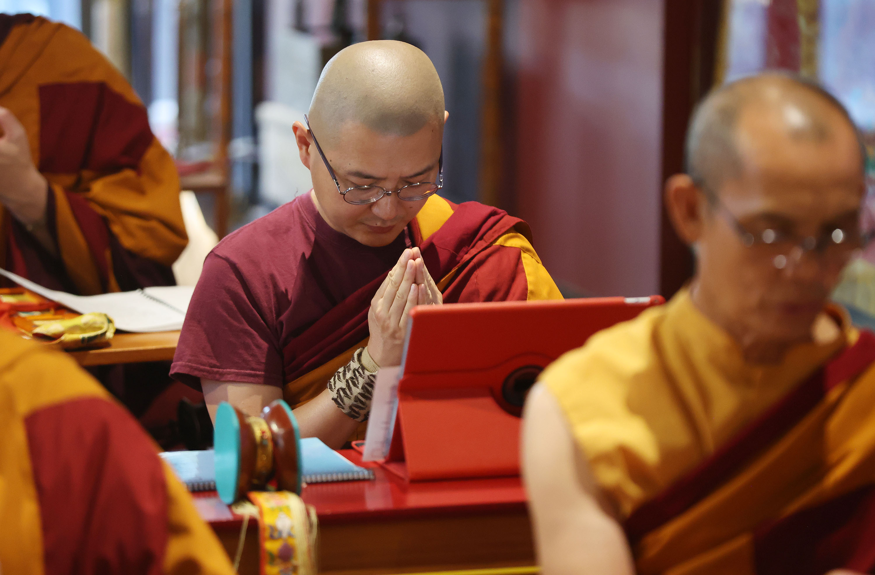 Practitioners at the Urgyen Samten Ling Tibetan Buddhist Temple participate in Prayers for Compassion in Salt Lake City on Thursday.